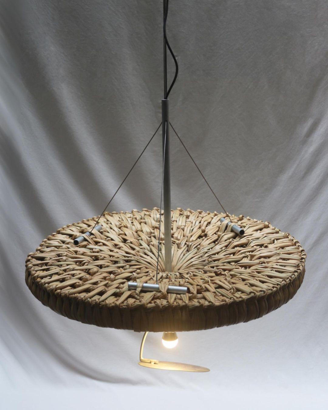 Candeeiro Pendant Lamp by Macheia
Handmade In Portugal.
Dimensions: Ø 80 x H 90 cm.
Materials: Natural dried bulrush and galvanized iron.

Candeeiro represents a play of concepts - to shed a light, literally, to the Bunho technique. Unconventionally