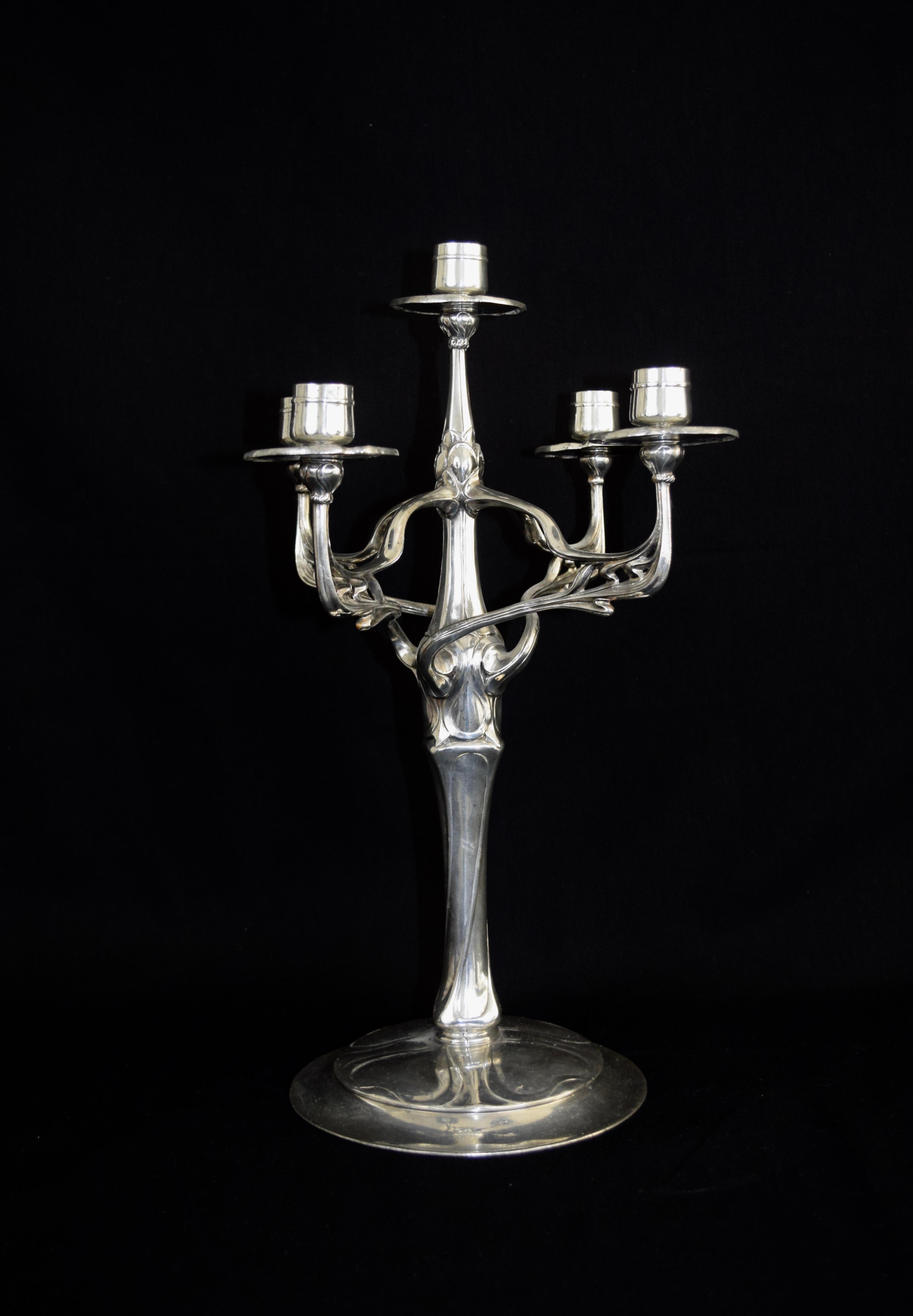 Impressive candelabra (in German Kerzenleuchter or Girandole) by the famous artist Friedrich Adler. This candelabra can be considered as one of his top pieces and is certainly one of the Jugendstil or Art Nouveau silver pewter top designs ever made.