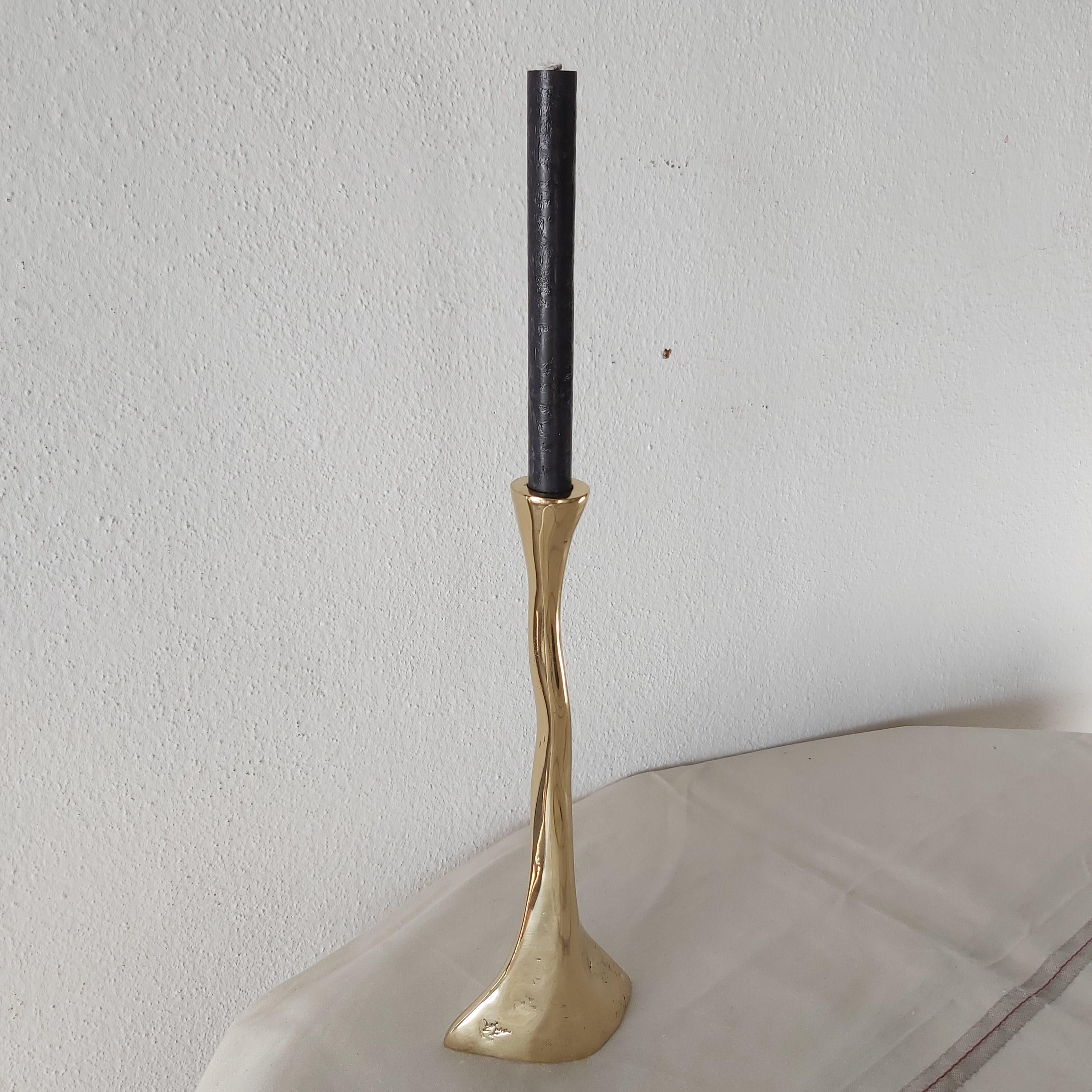 The decorative Candelabre was created by David Marshall, it is made of  sand cast brass.
Handmade, mounted and finished in our foundry and workshop in Spain from recycled materials.
Certified authentic by the Artist David Marshall with his