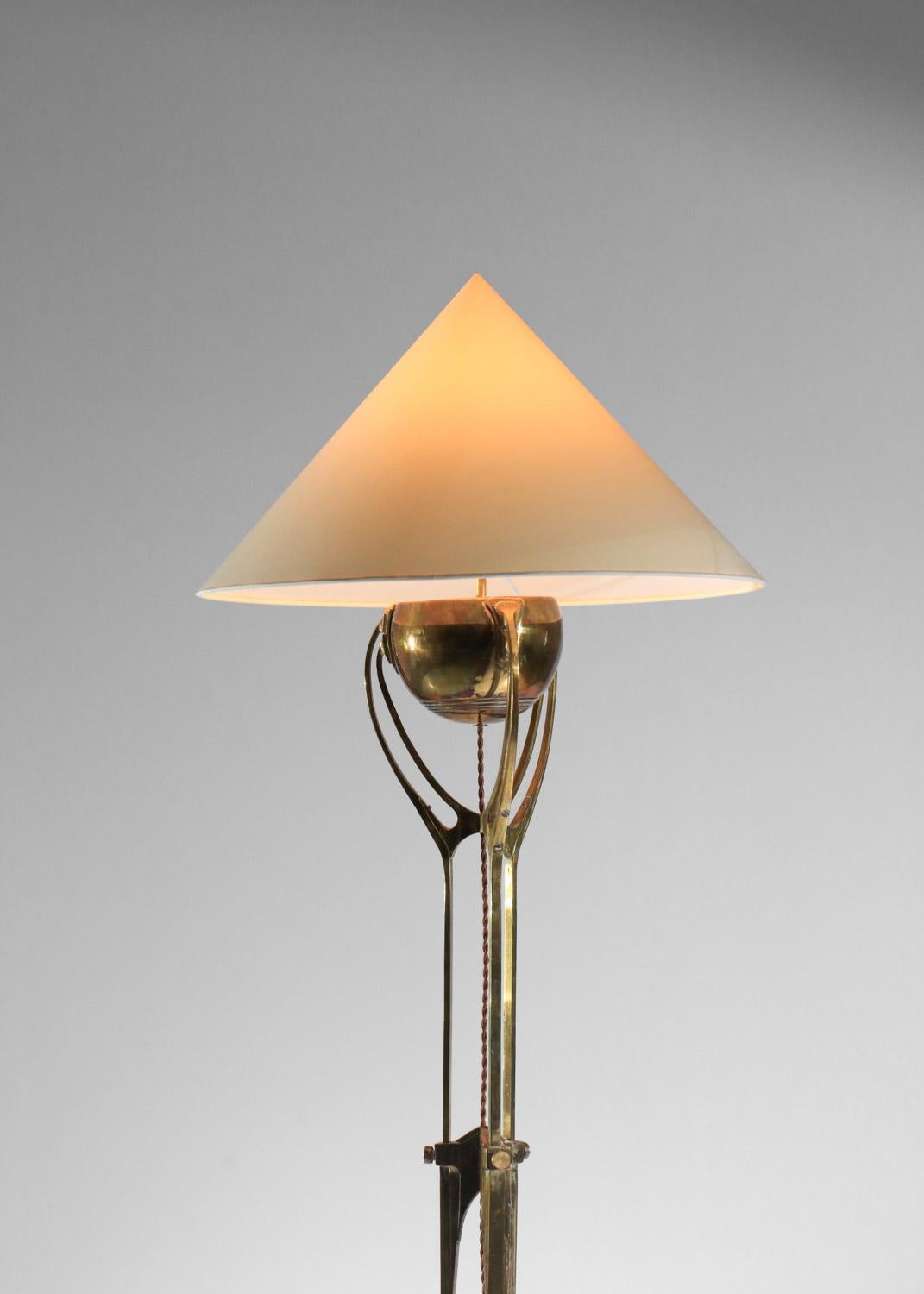 Antique art nouveau candelabra from the '40s transformed into a floor lamp. Solid brass structure resting on a tripod base, custom-made lampshades sold upon request and estimate. Very fine vintage condition, with a beautiful patina of age on the