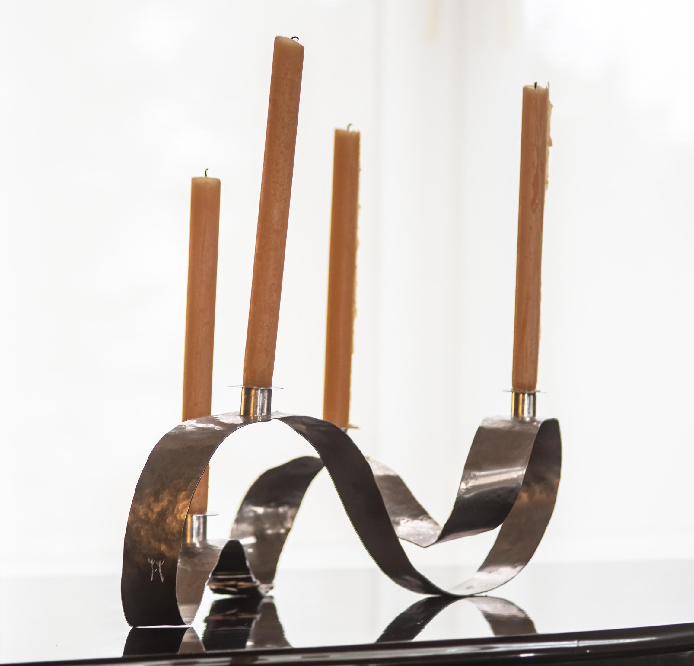 Unique sculpture / candelabra in aluminum hand hammered by Jacques Jarrige.
This tabletop, centerpiece can be commissioned to custom size.