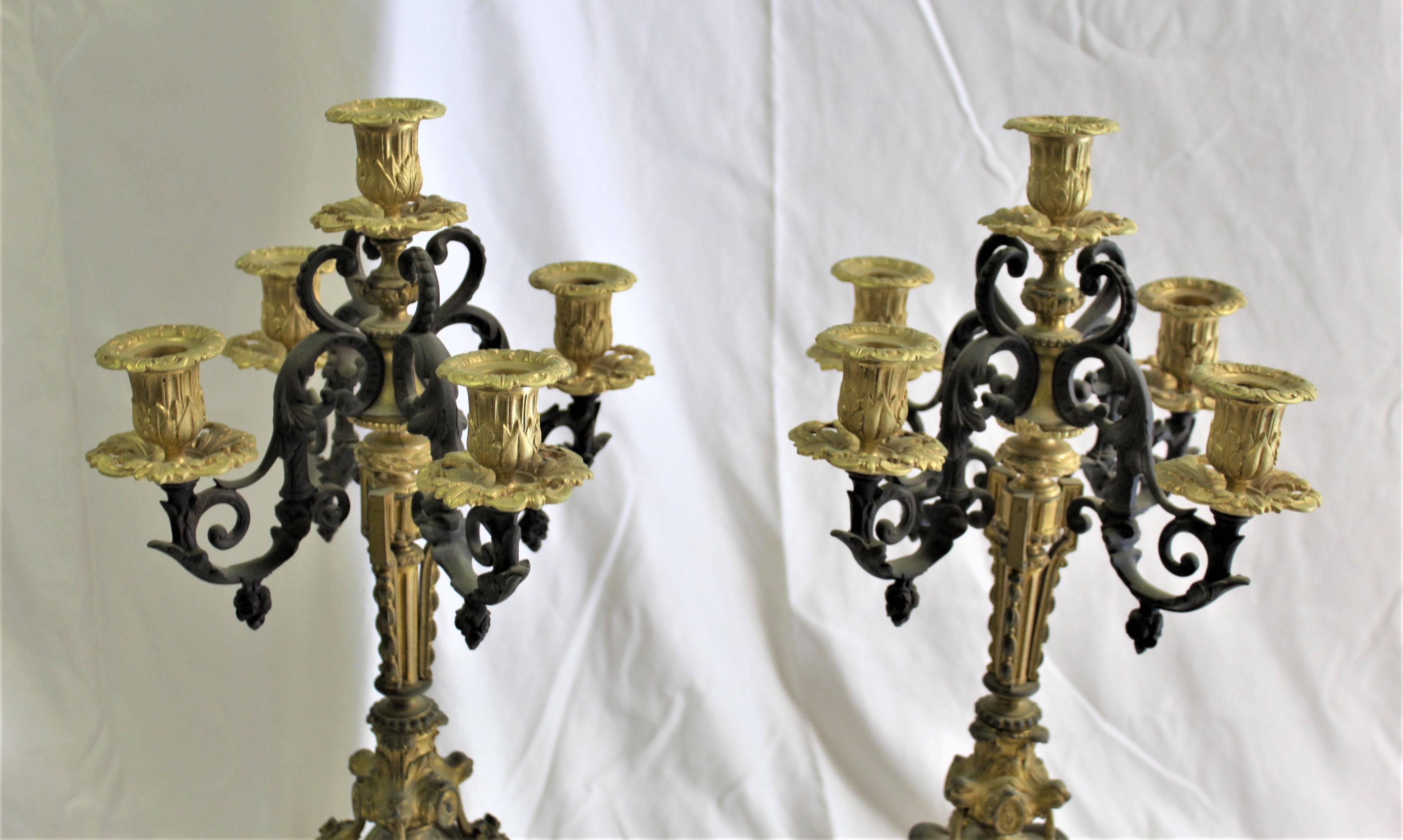 Great looking pair of 5 arm Candelabras. In two colors and Marble bases. In very good condition from an Antique collector in New Orleans. They have been well kept. These will require white glove packing and shipping at time of sale. Quote then with