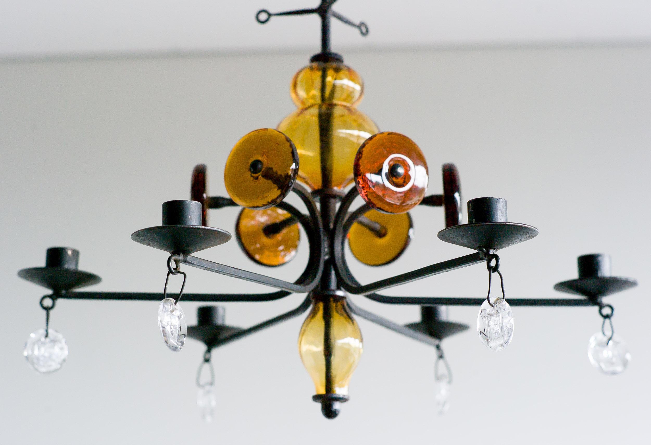 Wrought iron, clear and amber glass six-arm chandelier by Erik Hoglund for Boda.
 