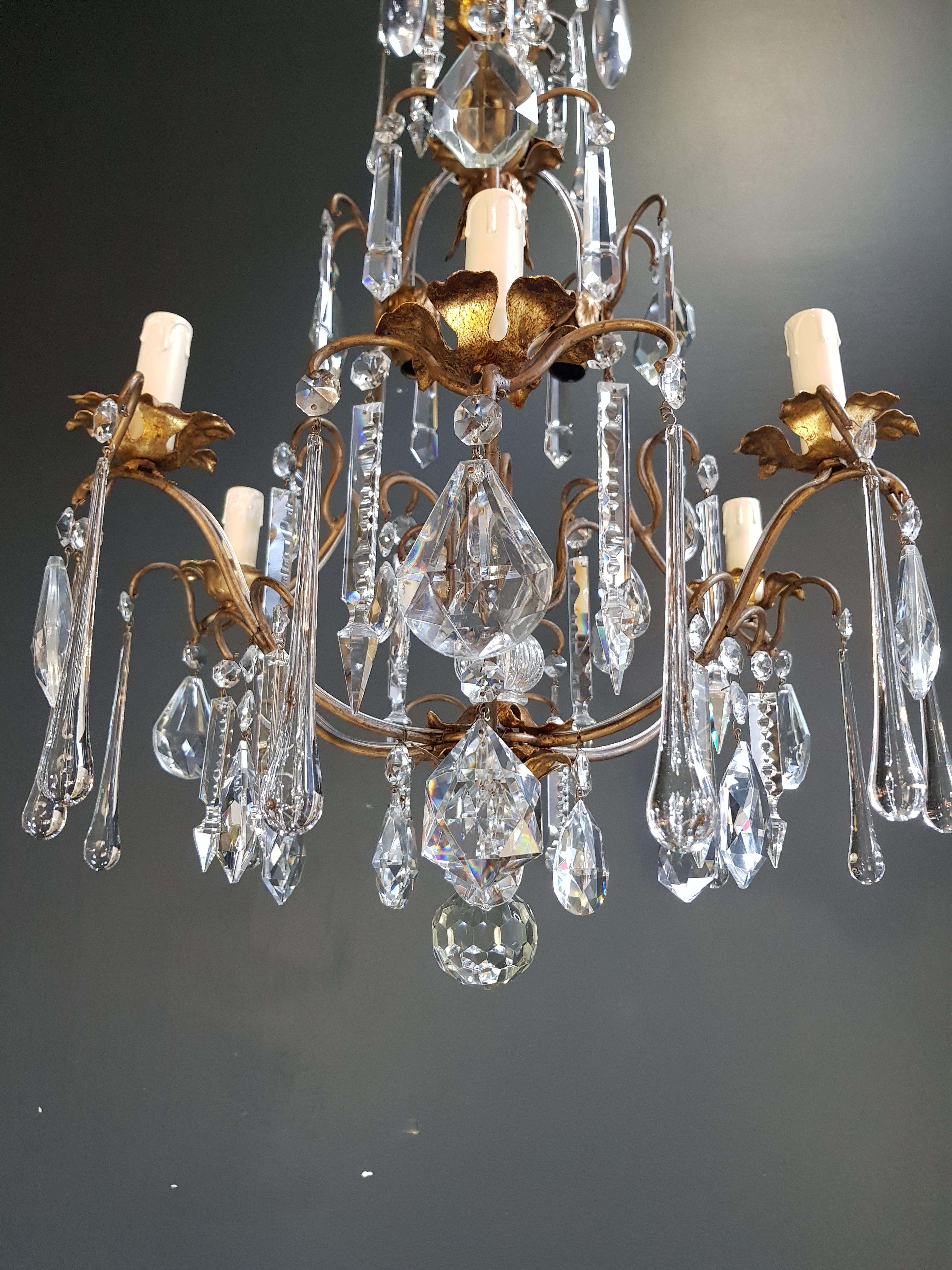 Preserved Vintage Chandelier: A Glimpse into 1950s Elegance

Step back in time with our authentic circa 1950 chandelier that has been meticulously preserved. With renewed cabling and sockets, and its crystal elements lovingly hand-knotted, this