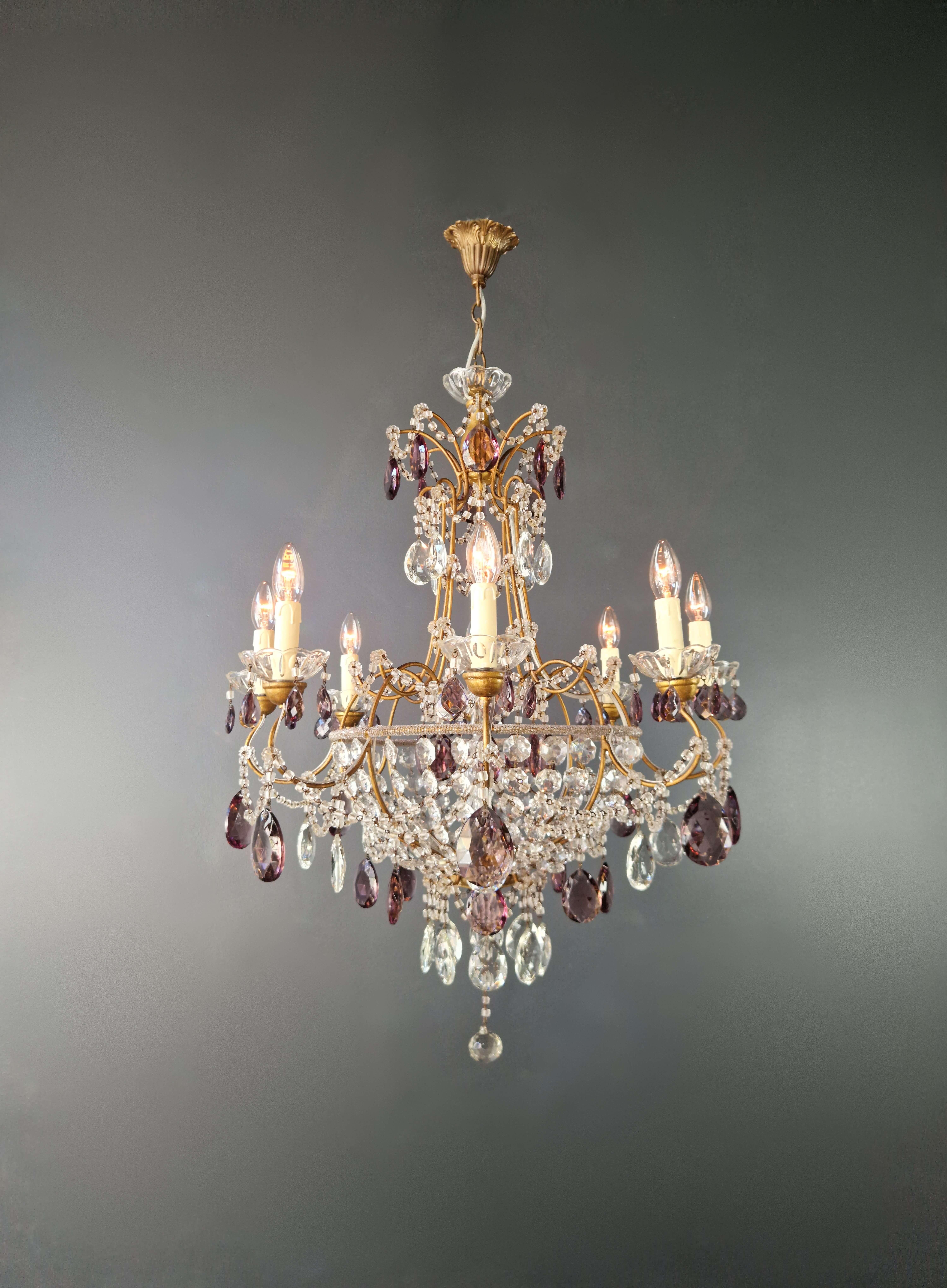 Introducing our exquisite antique crystal chandelier, a masterpiece that embodies the elegance of Italy.

With a height of 90 cm and a diameter of 72 cm, this chandelier exudes timeless charm. It weighs approximately 8kg and has 8 E14 bulb holders