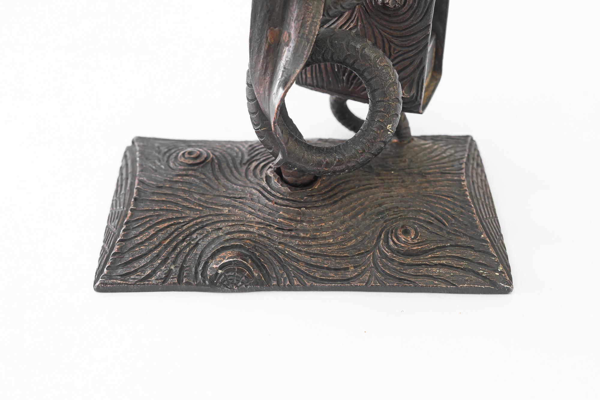 Austrian Wrought iron candle holder with snake and flower and match holder For Sale