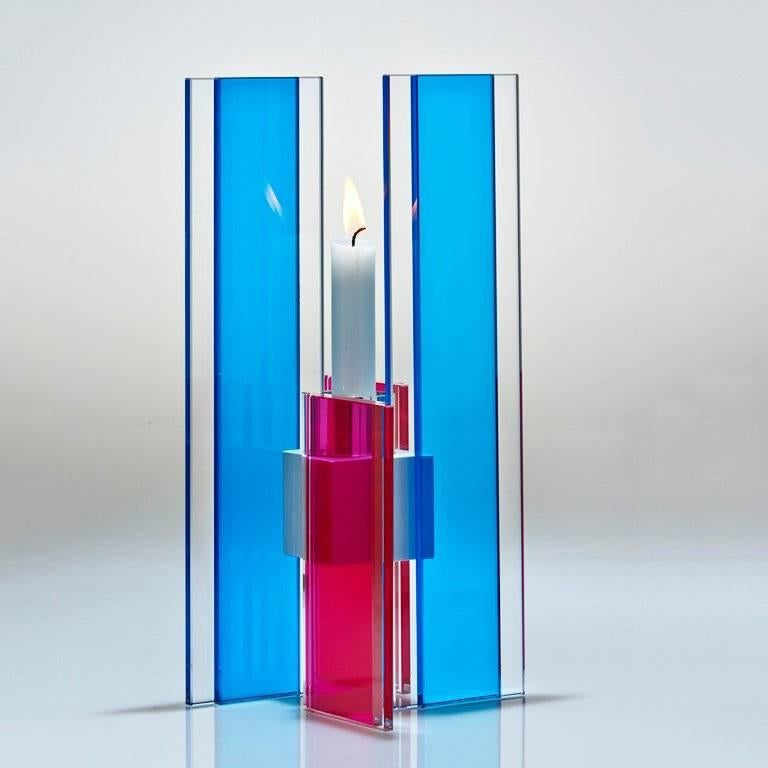 This polished glass candleholder from the Deco series is designed by world renowned glass artist, Sidney Hutter. With 40 years of experience in the contemporary glass and fine art world, Sidney now creates illuminated designs for the home. Create a