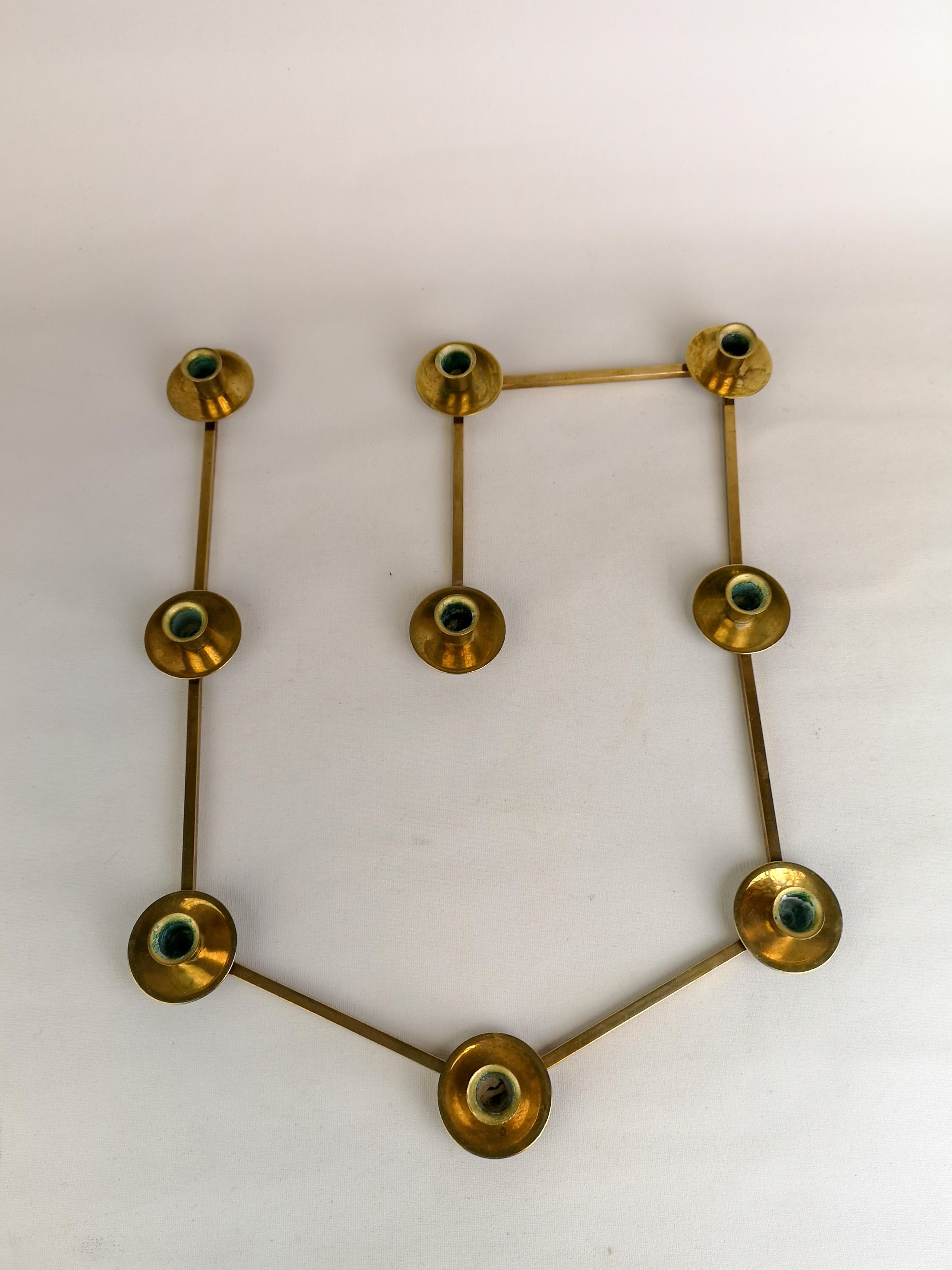 This candleholder in brass has endless possibilities in your creativity. Made in Sweden during the 1950s.

Good fair condition.

