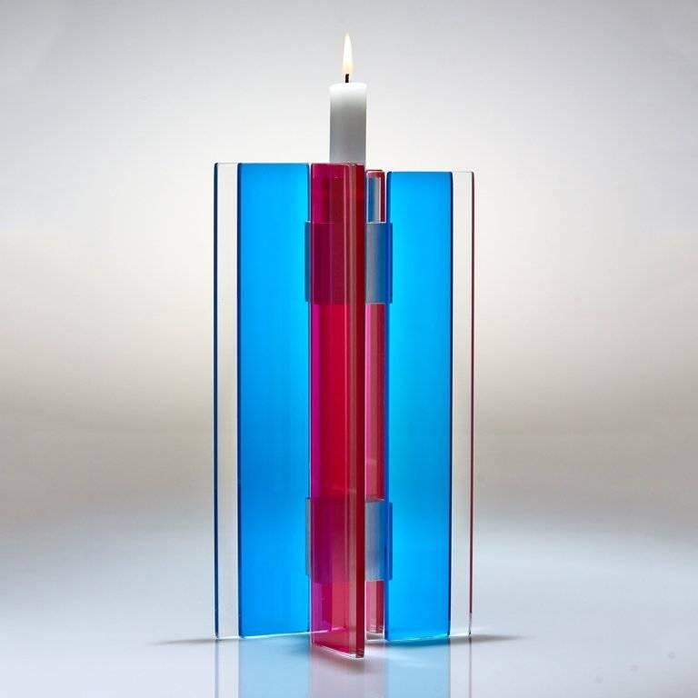 This polished glass candleholder from the Majestic series is designed by world renowned glass artist, Sidney Hutter. With 40 years of experience in the contemporary glass and fine art world, Sidney now creates illuminated designs for the home.