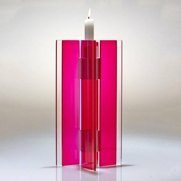 This polished glass candleholder from the Majestic series is designed by world renowned glass artist, Sidney Hutter. With 40 years of experience in the contemporary glass and fine art world, Sidney now creates illuminated designs for the home.