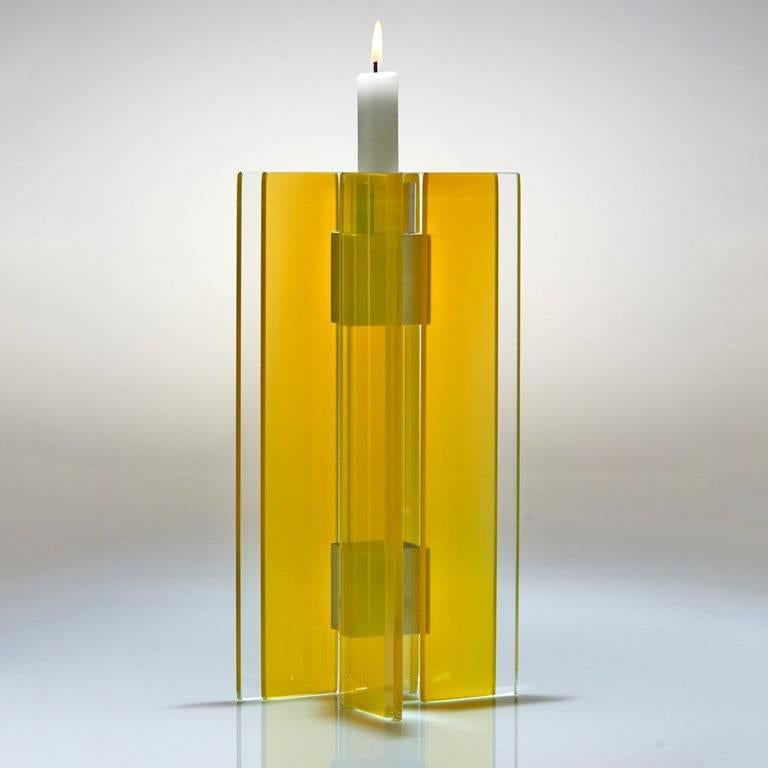 This polished glass candleholder from the Majestic series is designed by world renowned glass artist, Sidney Hutter. With 40 years of experience in the contemporary glass and Fine art world, Sidney now creates illuminated designs for the home.