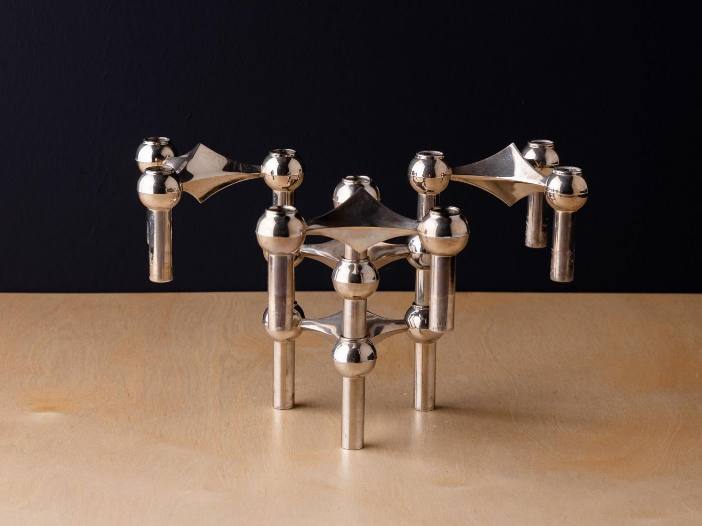 Timeless candleholder set from the 1960s by Werner Stoff for Hans Nagel. The chrome-plated candle holders can be combined and expanded at will. The offer includes 5 candle holders.

Quality Features:
 accomplished design: perfect proportions and