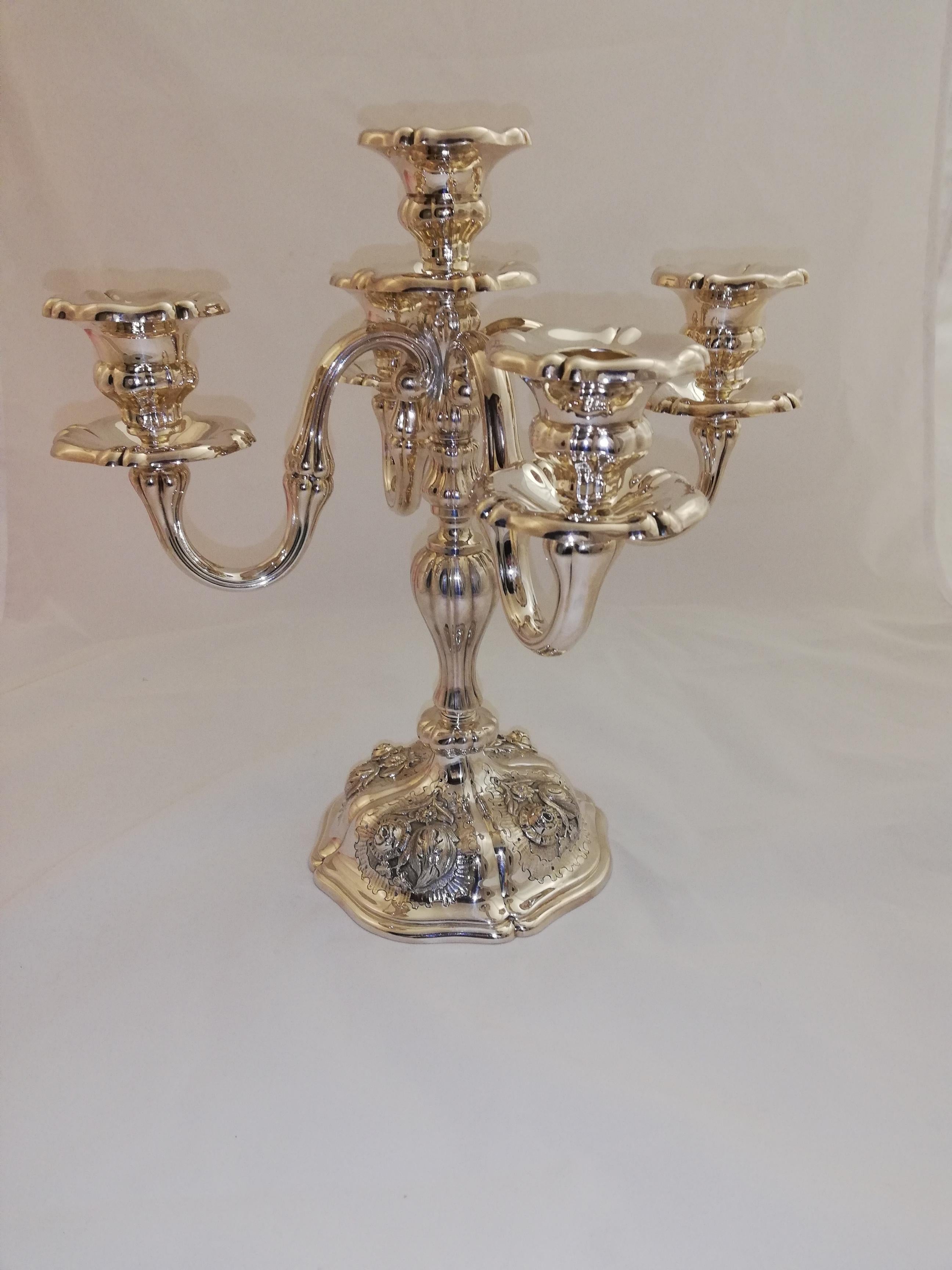 This solid sterling silver candleholder comes in a very heavy version.
All parts are removable thus it´s usable for a single candle as well as for four or five.
All details are hand-chiseled and in a extraordinary quality.

 