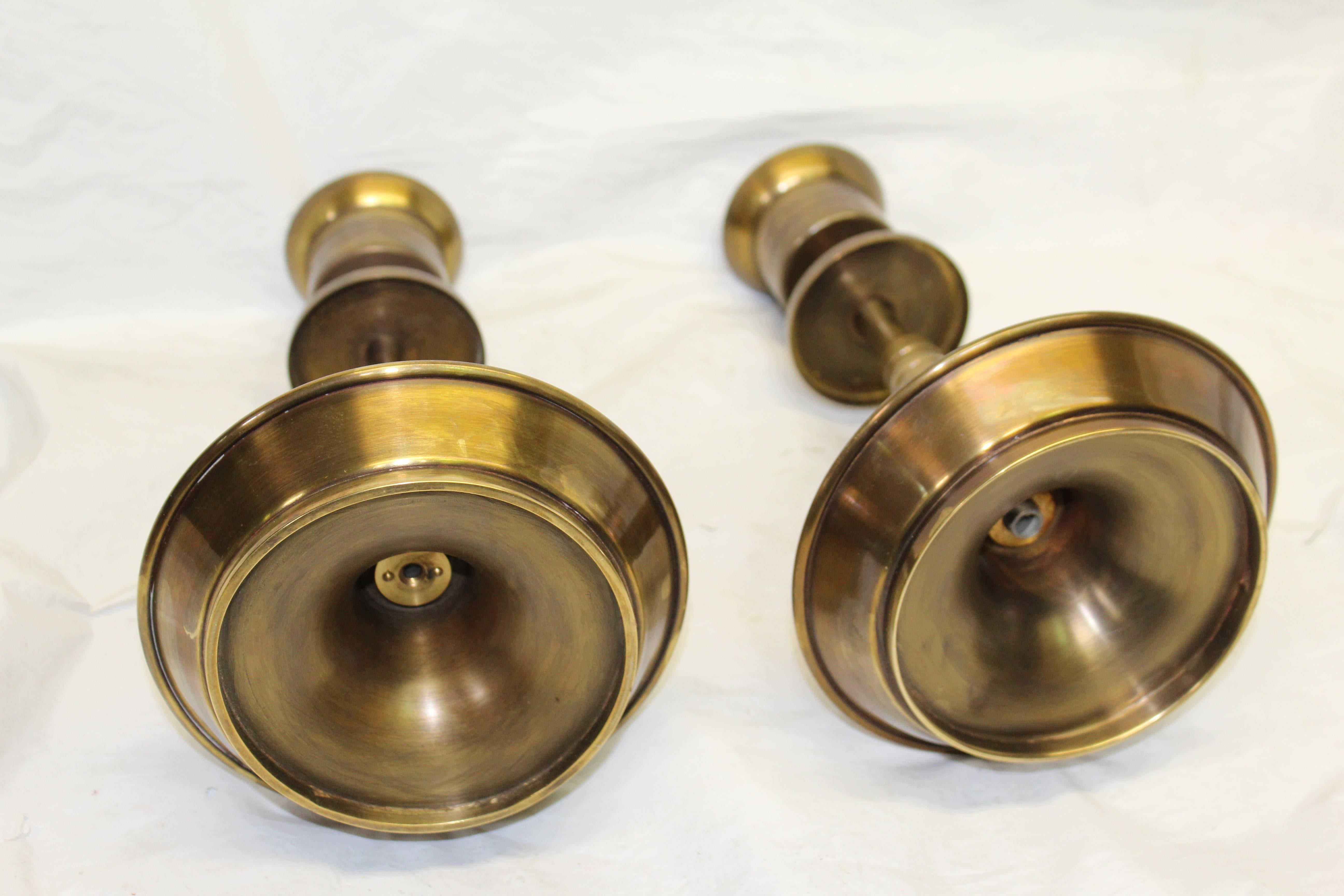 Modern design candlesticks in solid brass with an antique finish. After Parzinger.