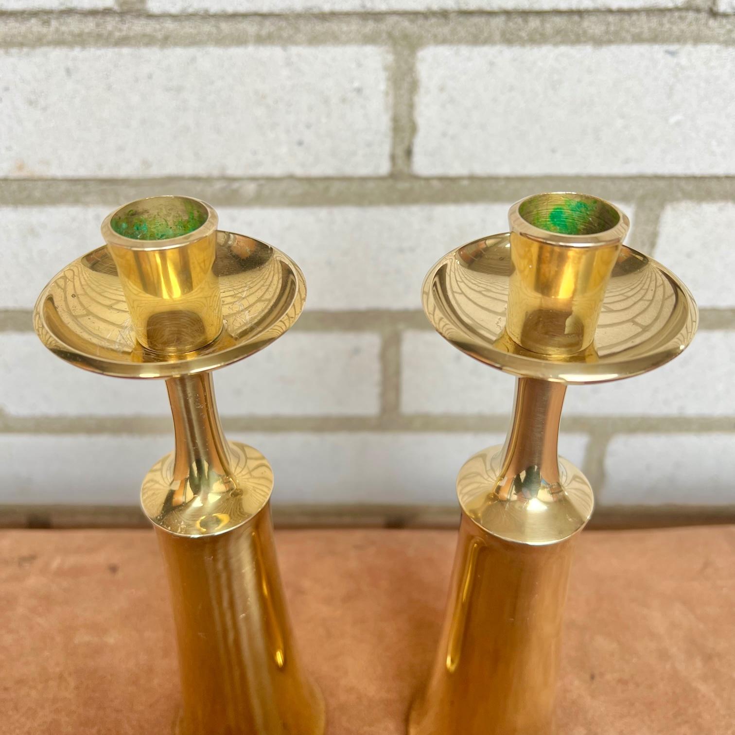 Candlesticks designed by Jens H. Quistgaard for Dansk Designs. Made In Denmark during the 1950s. Solid polished brass. The candlesticks are signed with hallmark. 

In vintage condition with some wear and patina.