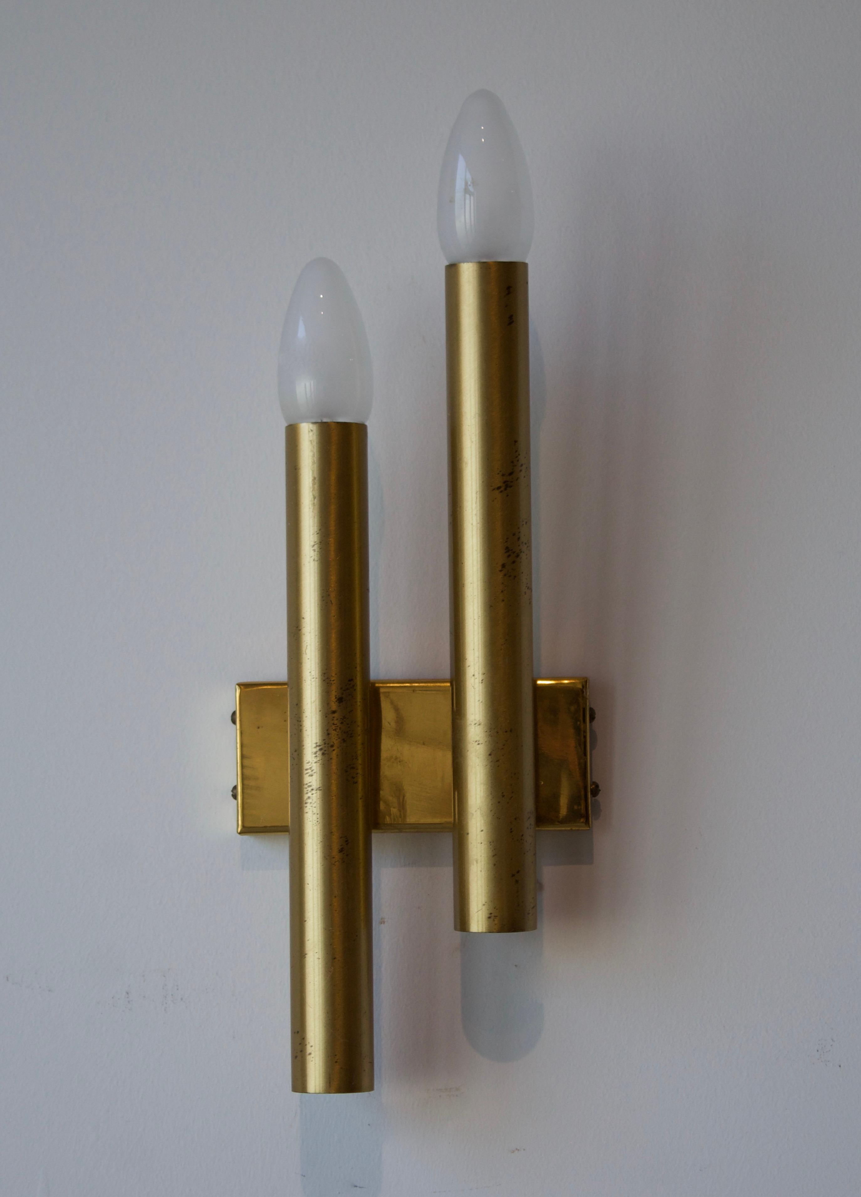 A pair of two-armed wall lights. Designed and produced in Italy, 1960s. Produced by Candle, Italy.

Other designers of the period include Paavo Tynell, Jean Royère, Hans Bergström, Hans-Agne Jakobsson, and Kaare Klint.