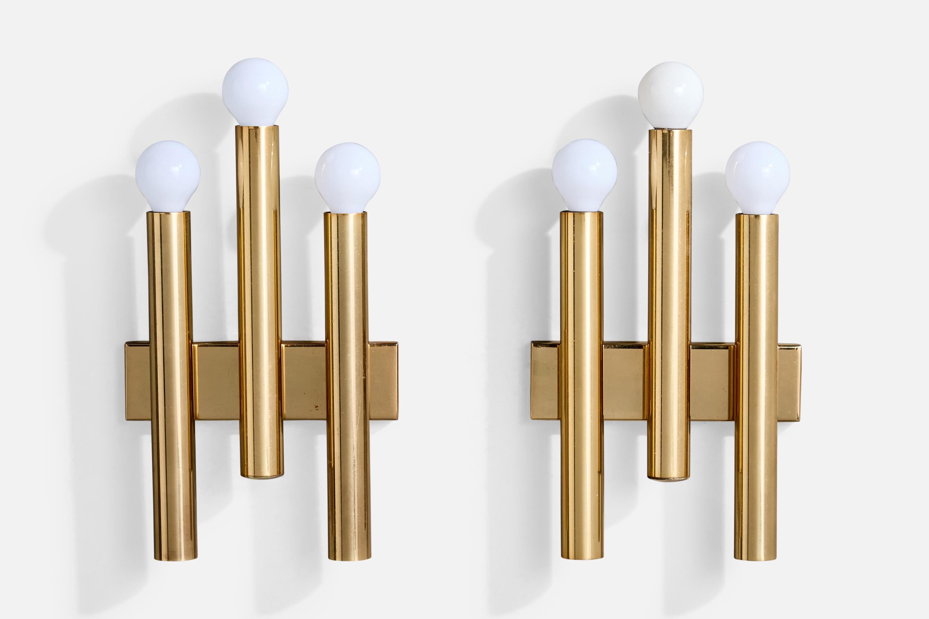 A pair of brass wall lights produced by Candle, Italy, c. 1960s.

Back Plate Dimensions (Inches):

All lighting will be converted for US usage. We are unable to confirm that any electrical item meets UL-Listing standards at our facility.

Does not
