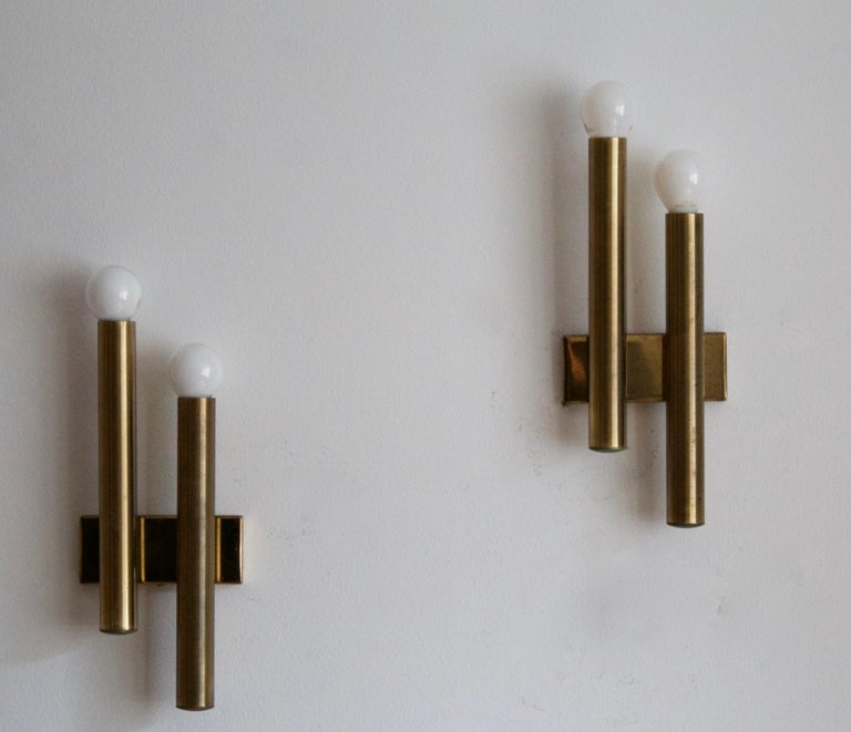 A pair of two-armed wall lights. Designed and produced in Italy, 1960s. Produced by Candle, Italy.

Other designers of the period include Paavo Tynell, Jean Royère, Hans Bergström, Hans-Agne Jakobsson, and Kaare Klint.