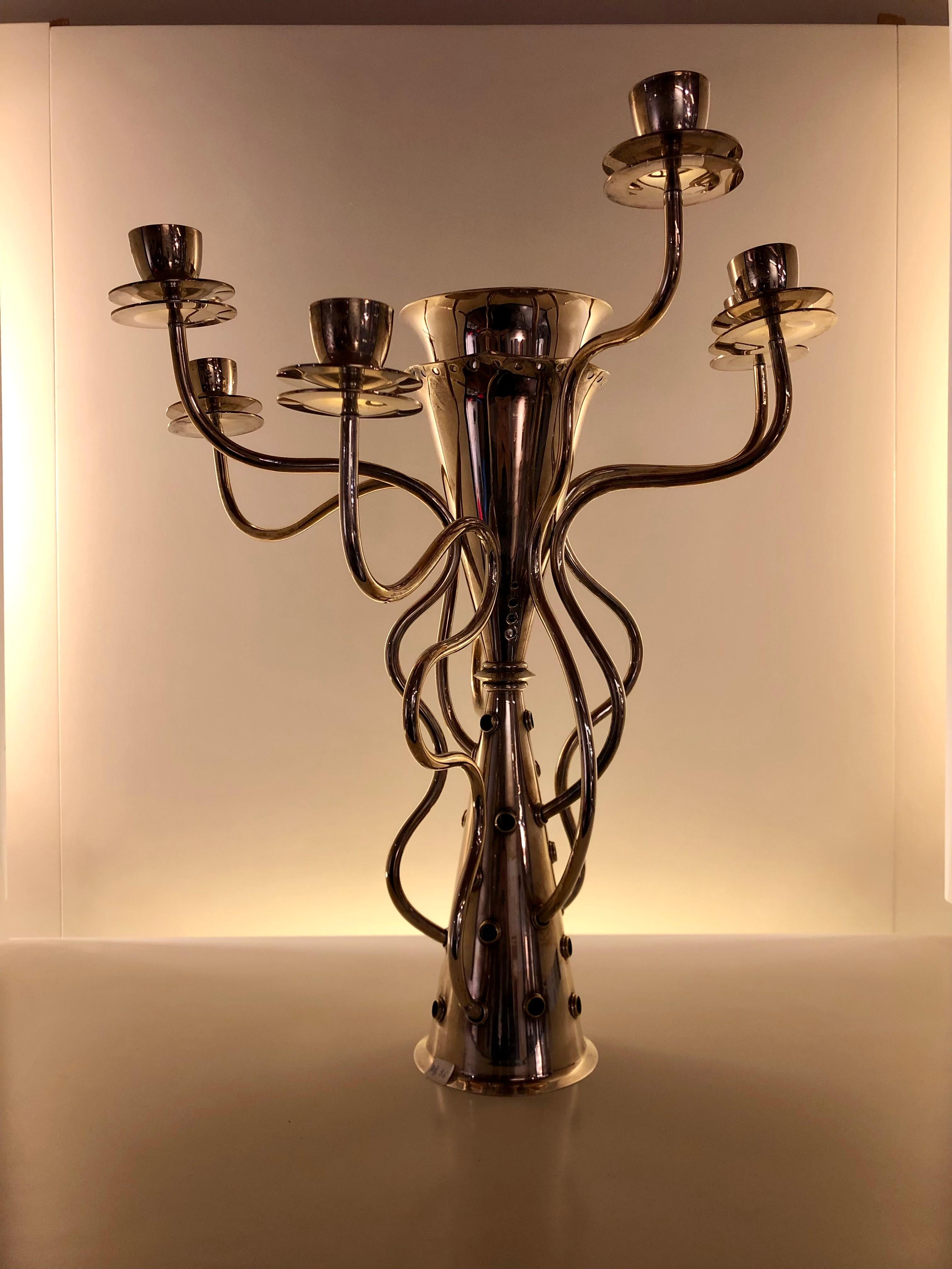 Silver plated metal candleholder “Simon” by Borek Sipek for Driade in the eighties.
You can also use the center like a flower vase.