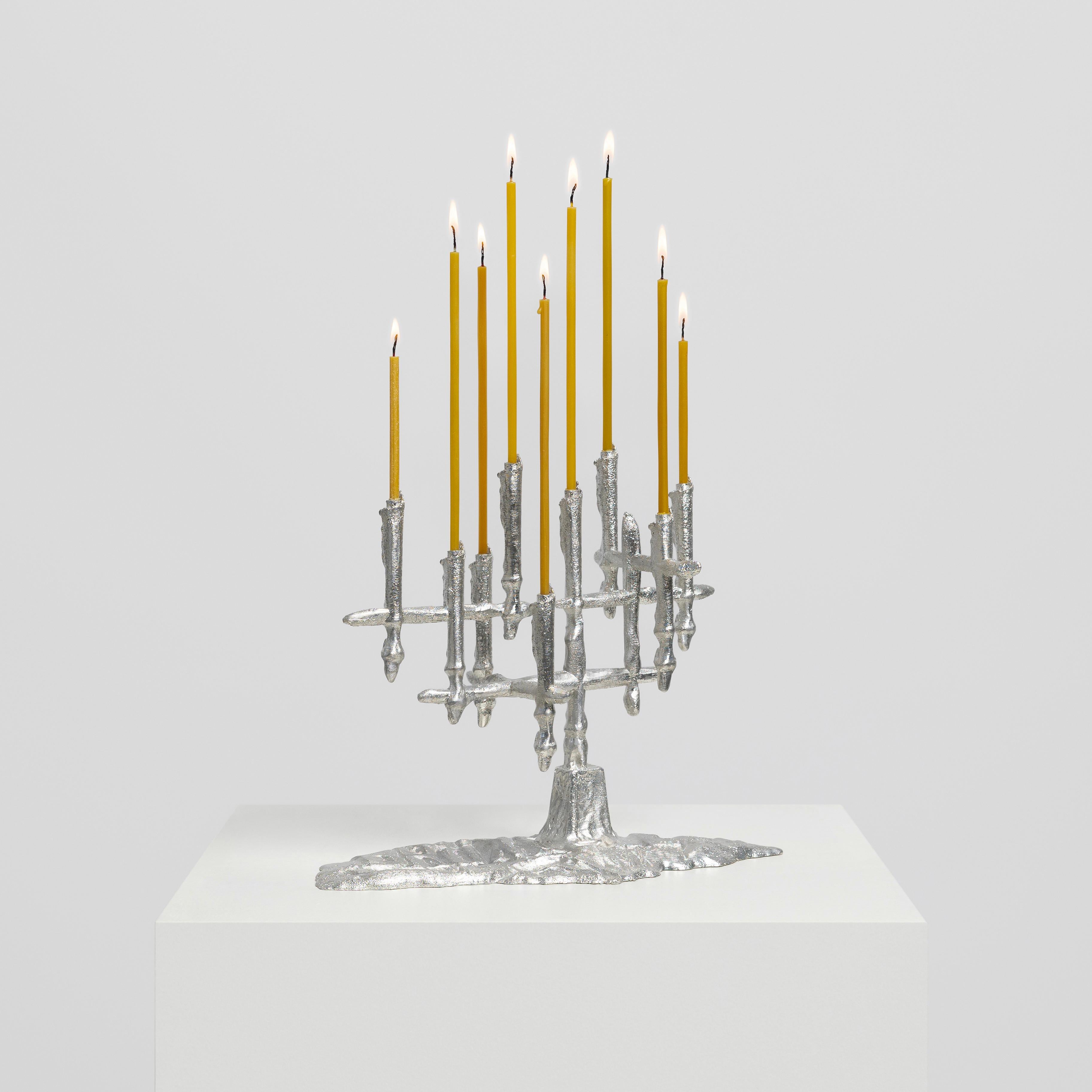 Candleholder is made based on innovative, modern digital technology and deep knowledge of the craft.

The artist in the creative process and in the structures of objects uses the forms of foil prints, which he randomly finds and imprints in the city