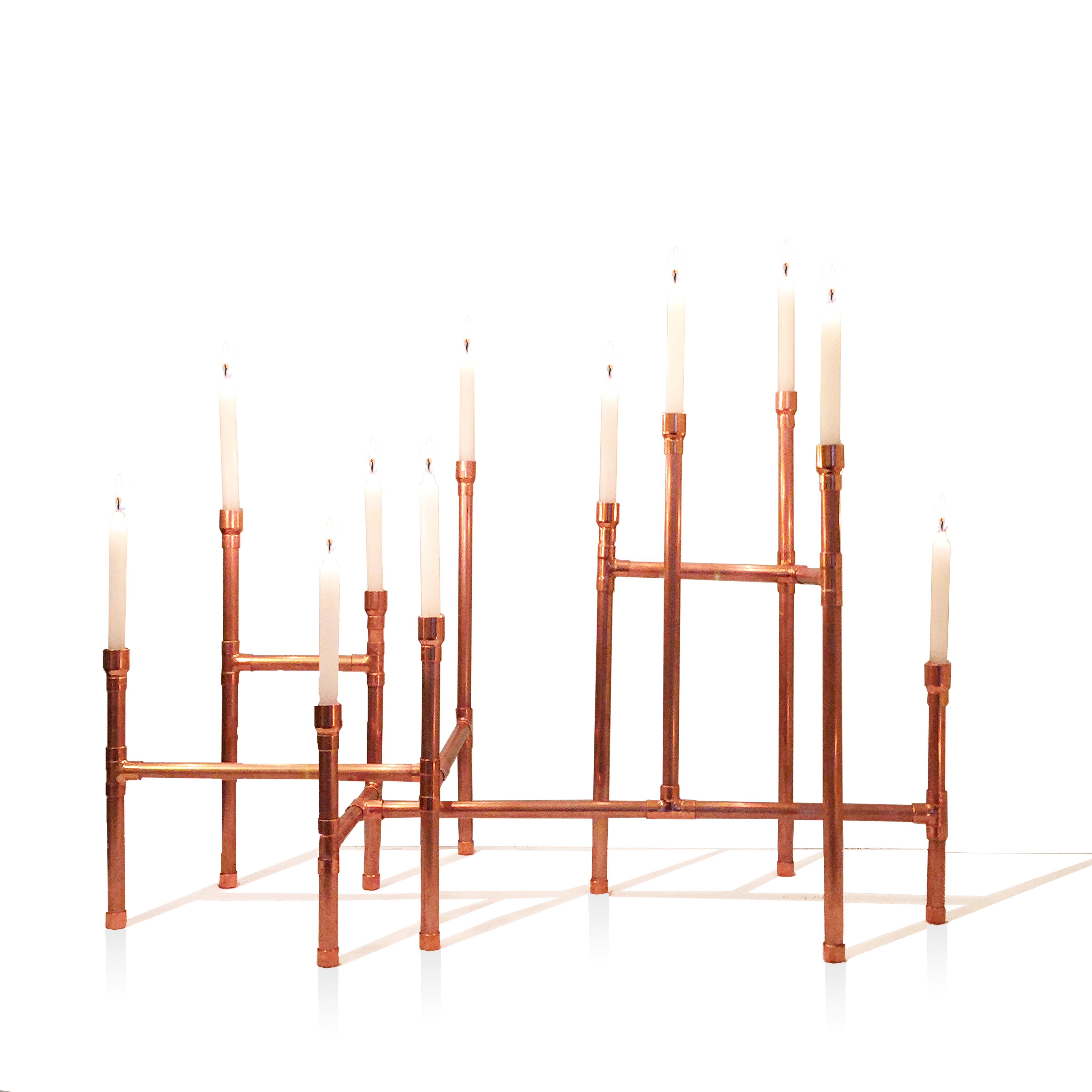 Candleholder in polished Copper for 11 candles, divided into 3 parts that overlap and that can assume diverse configurations and positions on the table. Its tips have different heights and are movable, being able to be changed giving several types