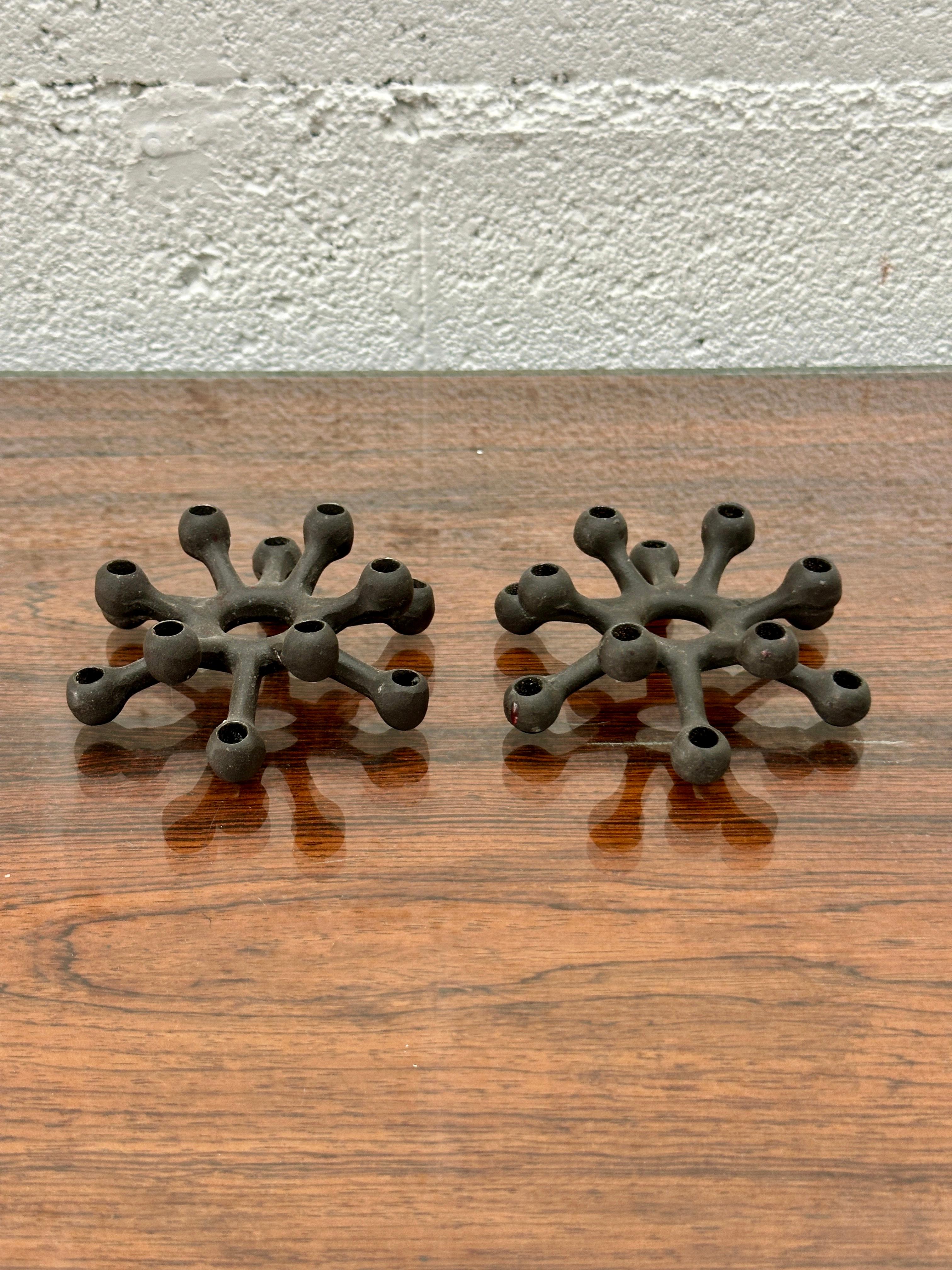SPIDER cast iron candleholder for Tiny Taper candles – also known as Flower Tapers. Including 2 boxes of 12 new original recipe hand dipped Tiny Tapers.

Designed by Jens Harald Quistgaard (IHQ) for DANSK DESIGNS in 1962, the SPIDER candlestick is a