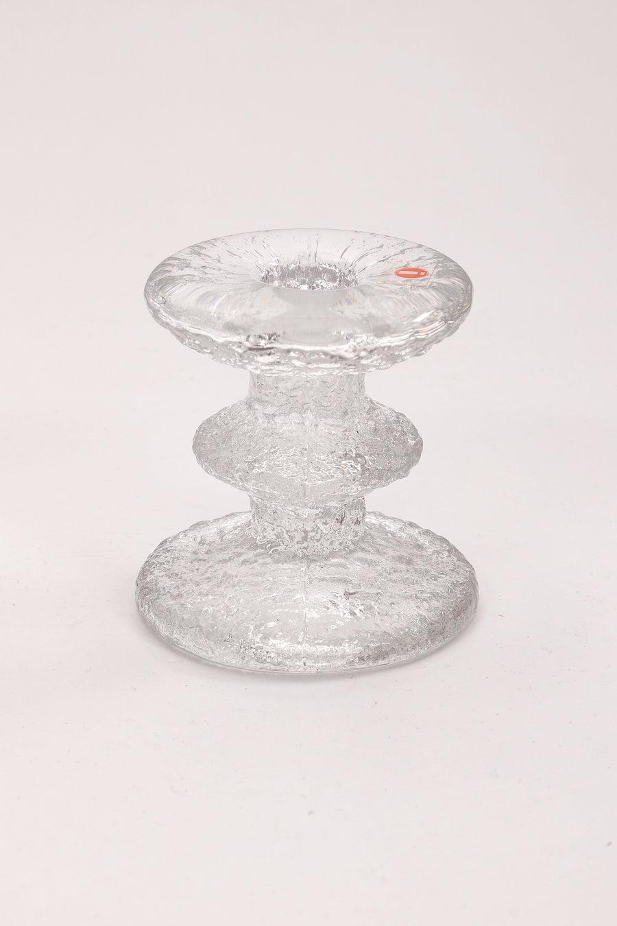  Glass Candlesticks Design by Staffan Gellerstedt, 1960s

Vintage iittala glass candlestick.Scandinavia: signed Iittala festivo candlestick with multiple rings design by Timo Sarpaneva from 1966. 
Timo Sarpaneva (1926-2006) was one of the greatest