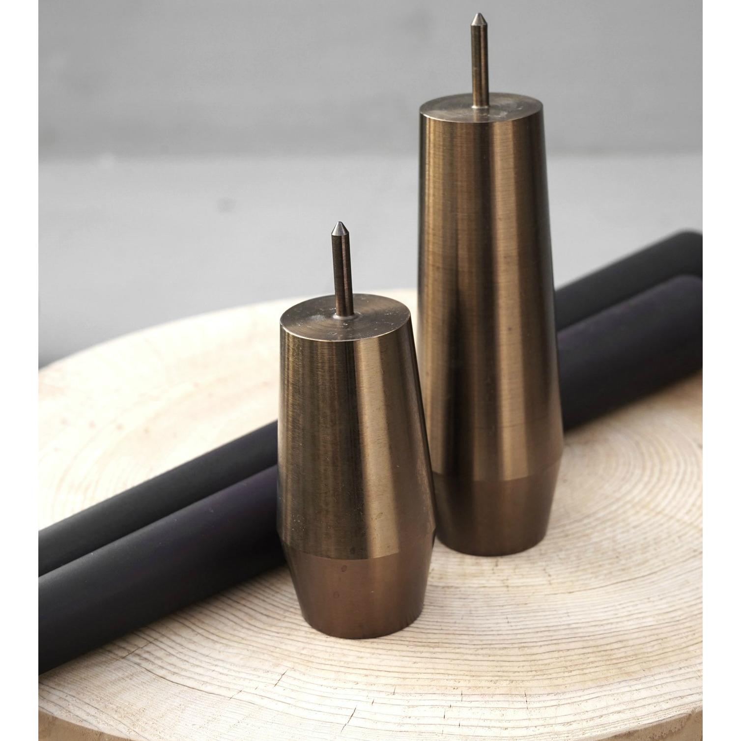 2 heat treated steel bases, with corresponding black 100% beeswax candles.

Barter Design hails from British Columbia. Their ethos is born from the belief that if we look to our natural environment we will find abundance in materials and natures