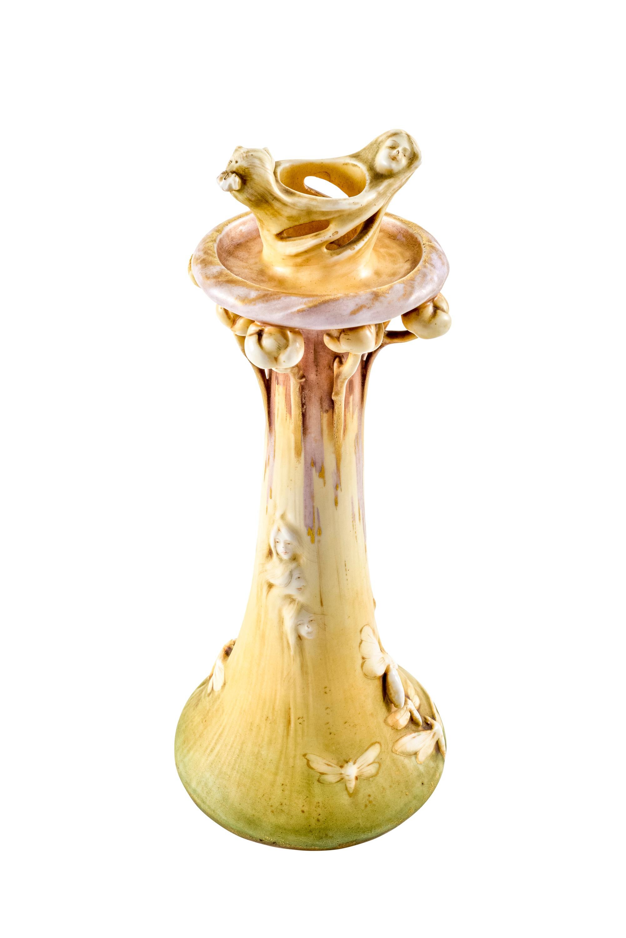 Symbolist Art Nouveau candlestick designed by Eduard Stellmacher manufactured by Amphora-Werke Riessner Stellmacher & Kessel Turn-Teplitz Bohemia, circa 1902

The candlestick exemplifies the unique features of ivory porcelain from the house of