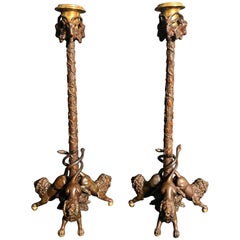 A Pair of Gilt Bronze Lion Figural Candlesticks