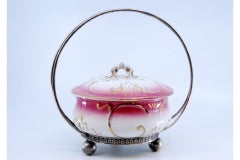 Candy box w/ silver structure & porcelain tank, resting on three spherical feet