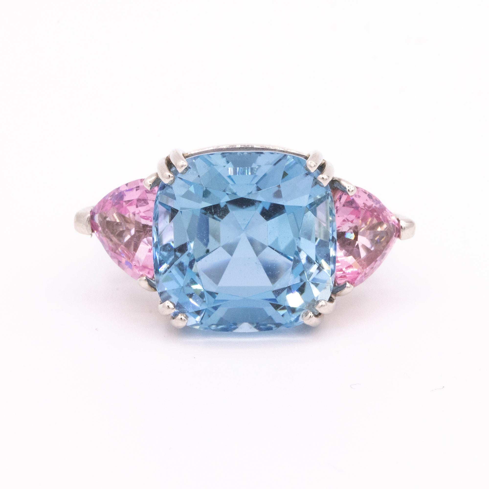 The three-stone ring gets a candy-colored makeover, thanks to a 12-carat cushion-cut ocean-blue aquamarine and over three-carats of lush pink spinels. There is something feminine and fun about choosing a ring like this, with its outsize gumball