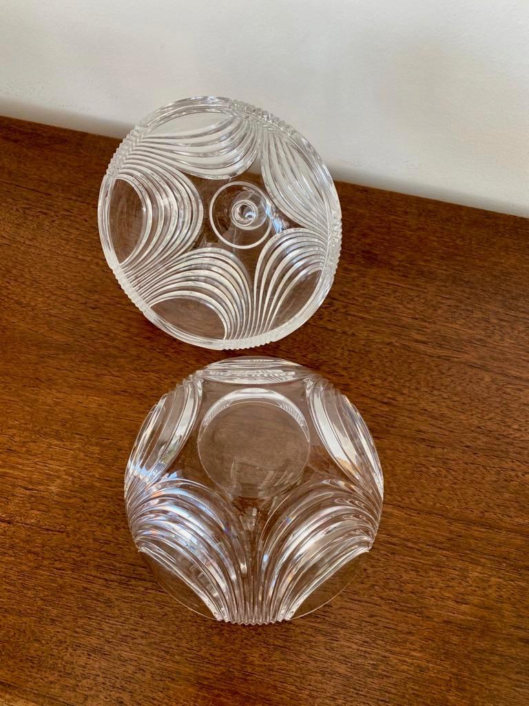 Art Deco candy crystal jar from mid century. It is elegant and beautifully carved jar, perfect to put chocolats or sweets. It will add a touch of elegance to your table.