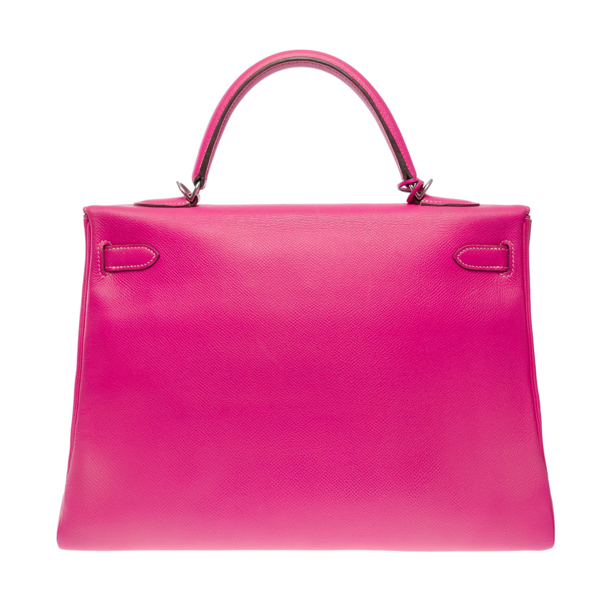 Magnificent & Rare Hermes Kelly 35 retourne from the Candy limited edition Collection in Rose Tyrien Epsom leather with white stitching and Ruby leather interior, palladium silver metal hardware, double pink leather handle for hand or shoulder