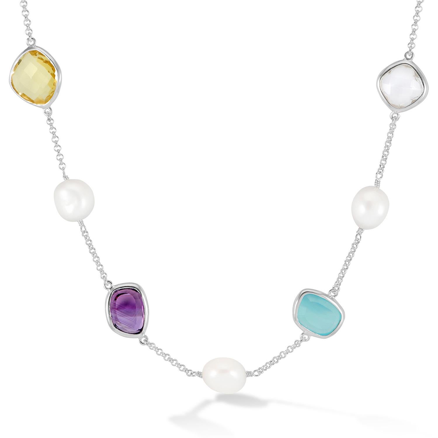 Handcrafted in sterling silver, this chain necklace is adorned with five white baroque pearls and four faceted gemstones in a mix of amethyst, rock crystal, lemon quartz and green chalcedony. Baroque pearls are naturally irregular in shape and known