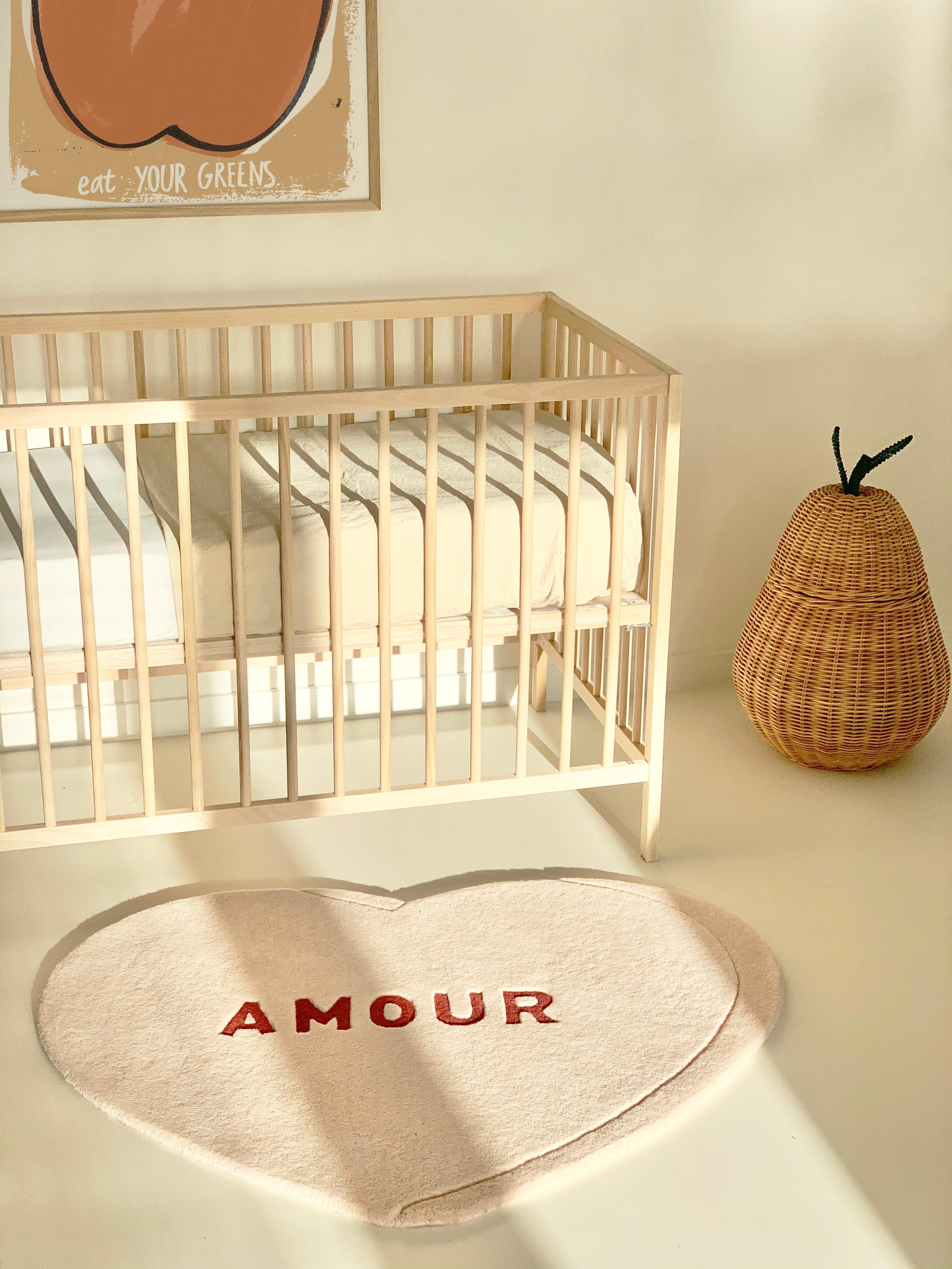 The Candy Heart Rug is a durable and sweet rug that fits any nursery or kids room. This super soft rug made of 100% New Zealand wool is hand-tufted and hand carved by artisans in India. The letters 'AMOUR' are sheared in a lower pile to create a 3D