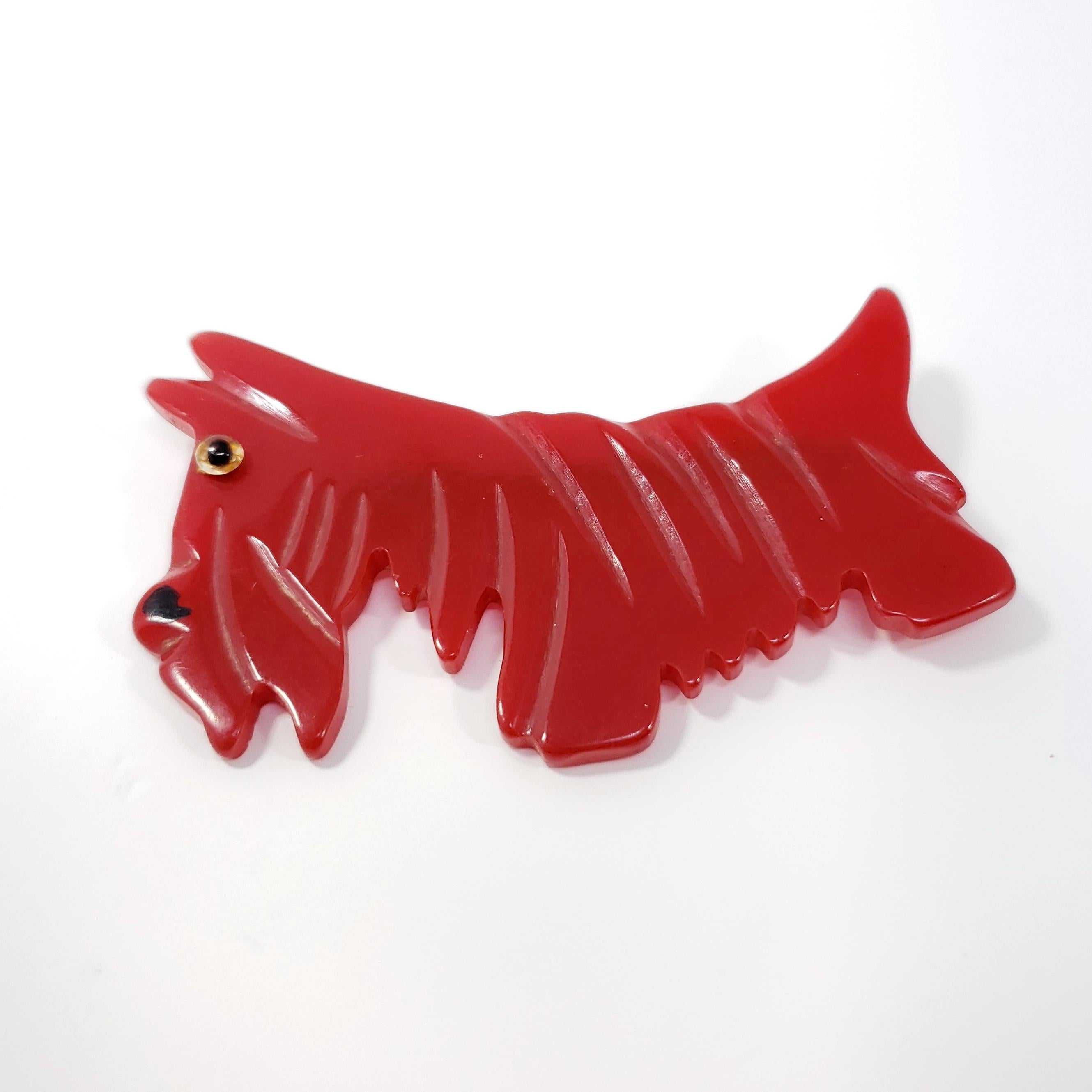 Candy red bakelite schnauzer pup pin brooch from the early 1900s. Wonderful condition.

