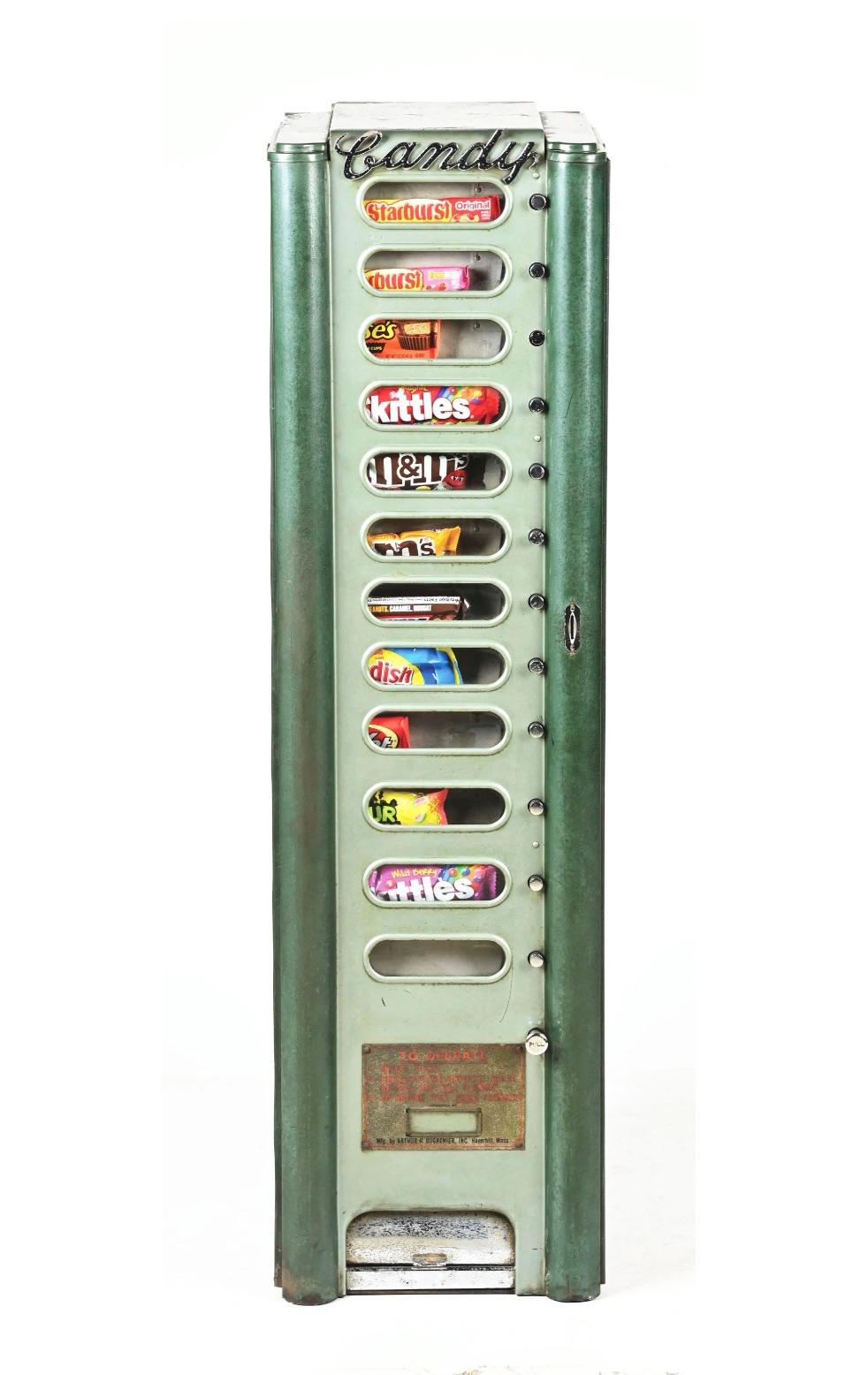 Vintage circa 1950s candy vending machine made by Arthur H. Dugrenier. The cabinet is painted in light mint and green colors with chrome trim giving this piece a beautiful, art deco’esque theme. Chrome letters run across the top of the machine that