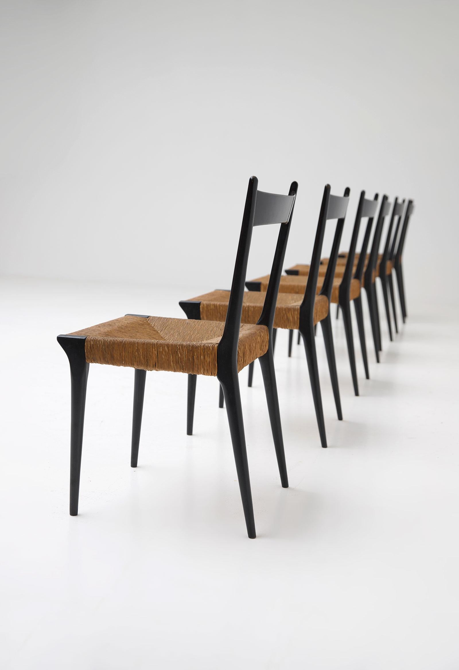 Mid-20th Century Cane and Black Lacquered Dining Chairs by Alfred Hendrickx, Set of Six For Sale