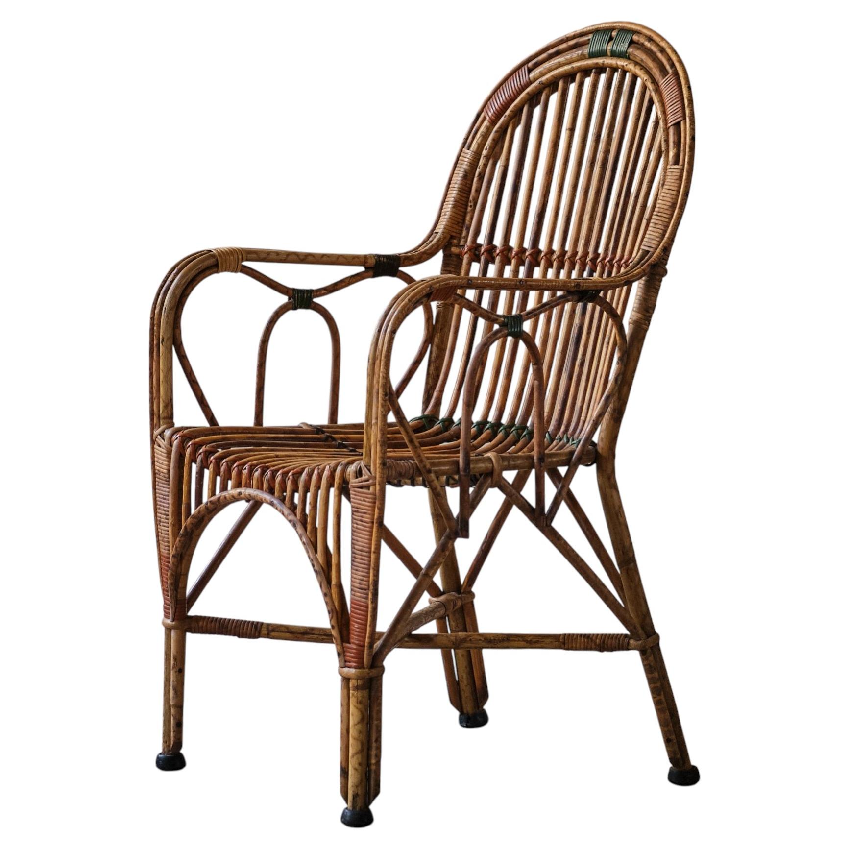 Cane and rattan armchair For Sale