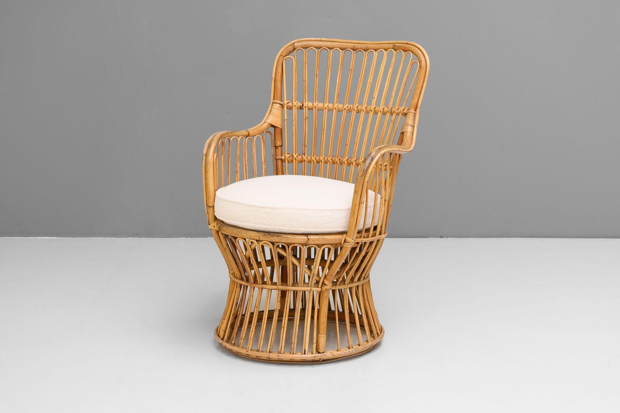 Mid-Century single cane armchair with new boucle covered seat cushion. France circa 1960.

H 85cm (SH 49cm) x W 56cm x D 65cm