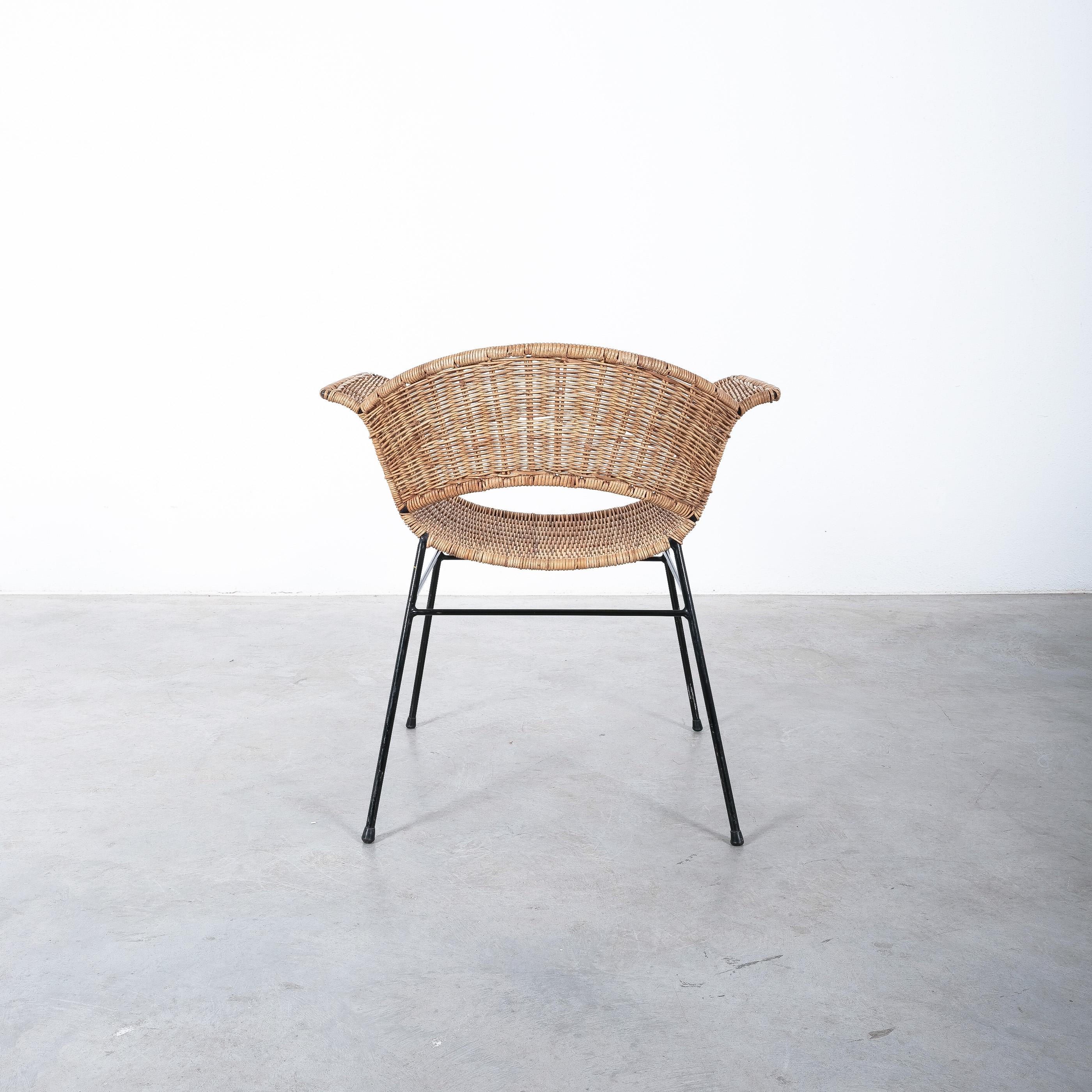 Anna-Lülja Praun attr. wicker chair and ottoman, Austria, 1950s

Mid-century chair and ottoman made from woven cane. 
Both show minor wear and are stable and undamaged with repairs to the wicker. 
Dimensions are 21.26