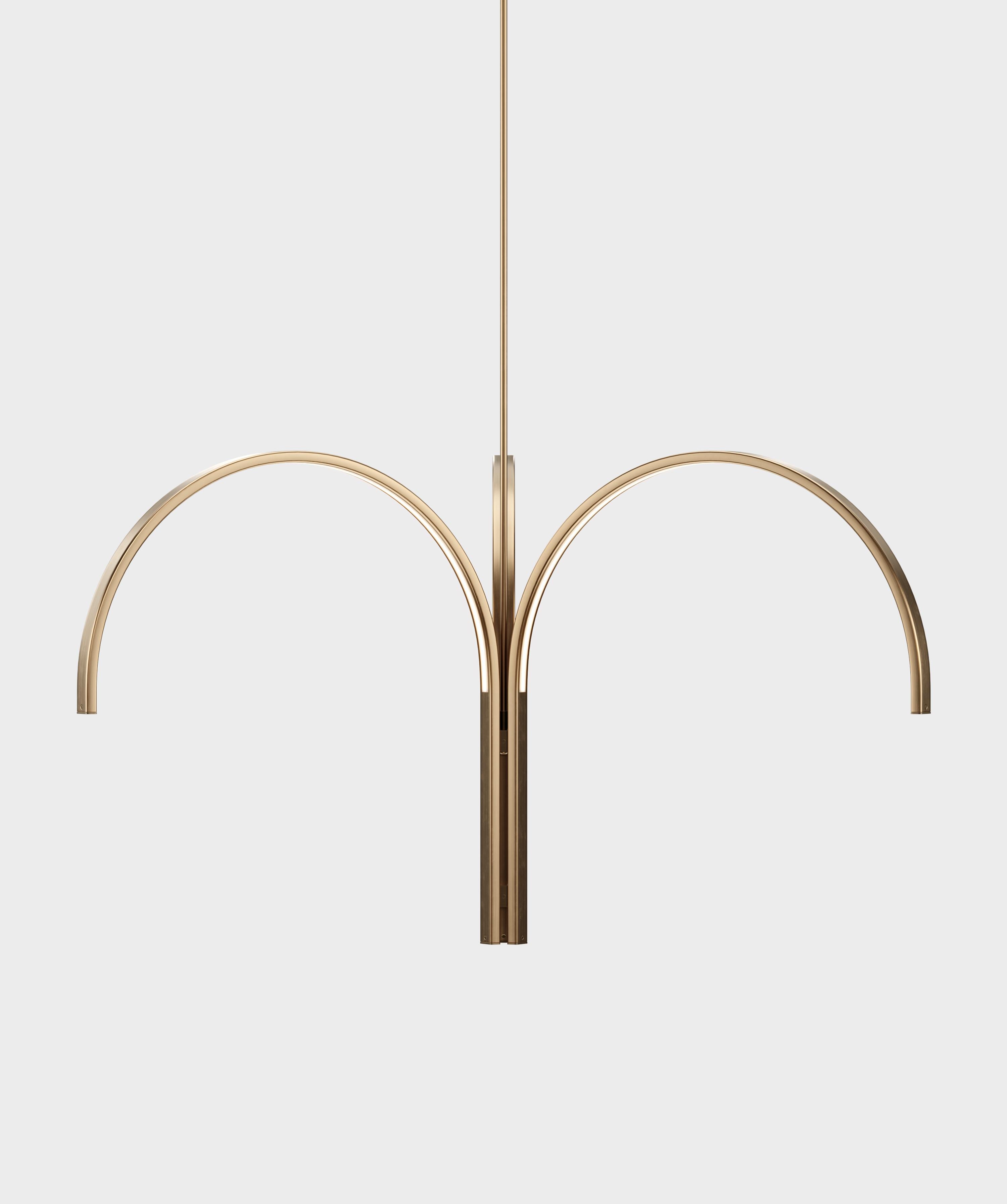 The Cane Cluster is the newest addition to our Cane Collection, a series of lights built from a curved steel armature. The striking chandelier consists of three elegantly curved steel components joined by a vertical stem. Its sculptural silhouette