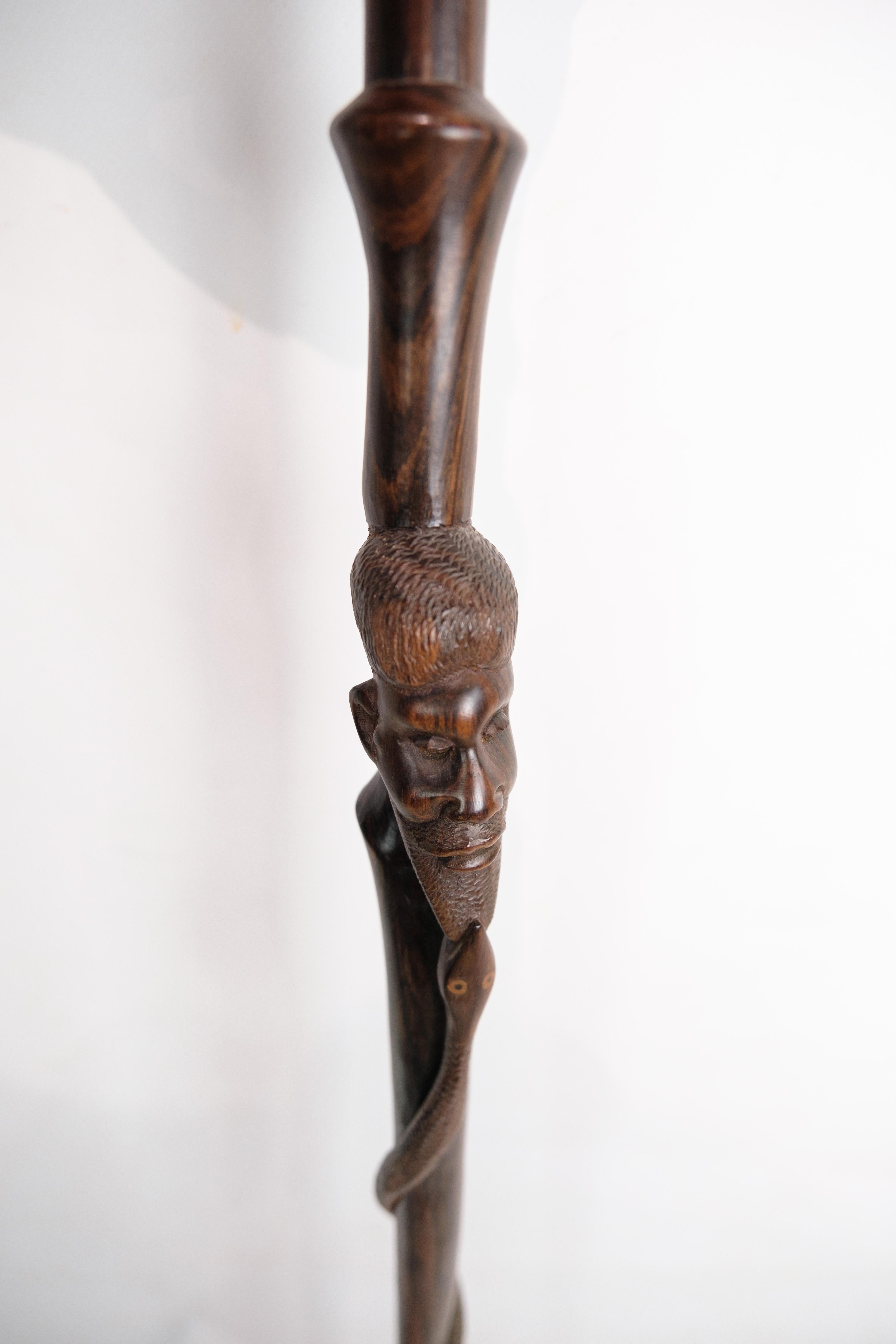 Cane in rosewood with a carved motif of a man being bitten by a snake 1960 For Sale 7