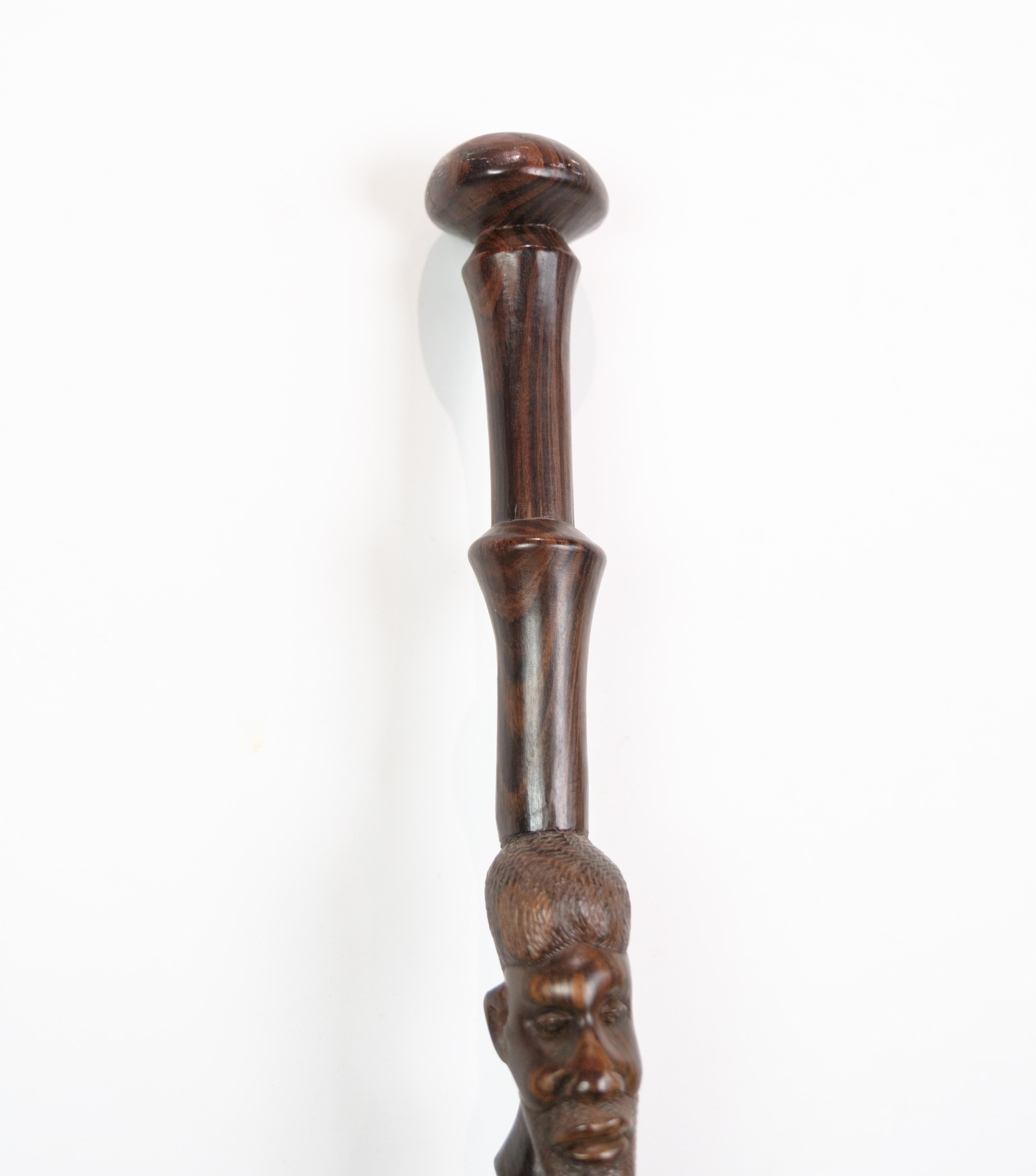 Danish Cane in rosewood with a carved motif of a man being bitten by a snake 1960 For Sale