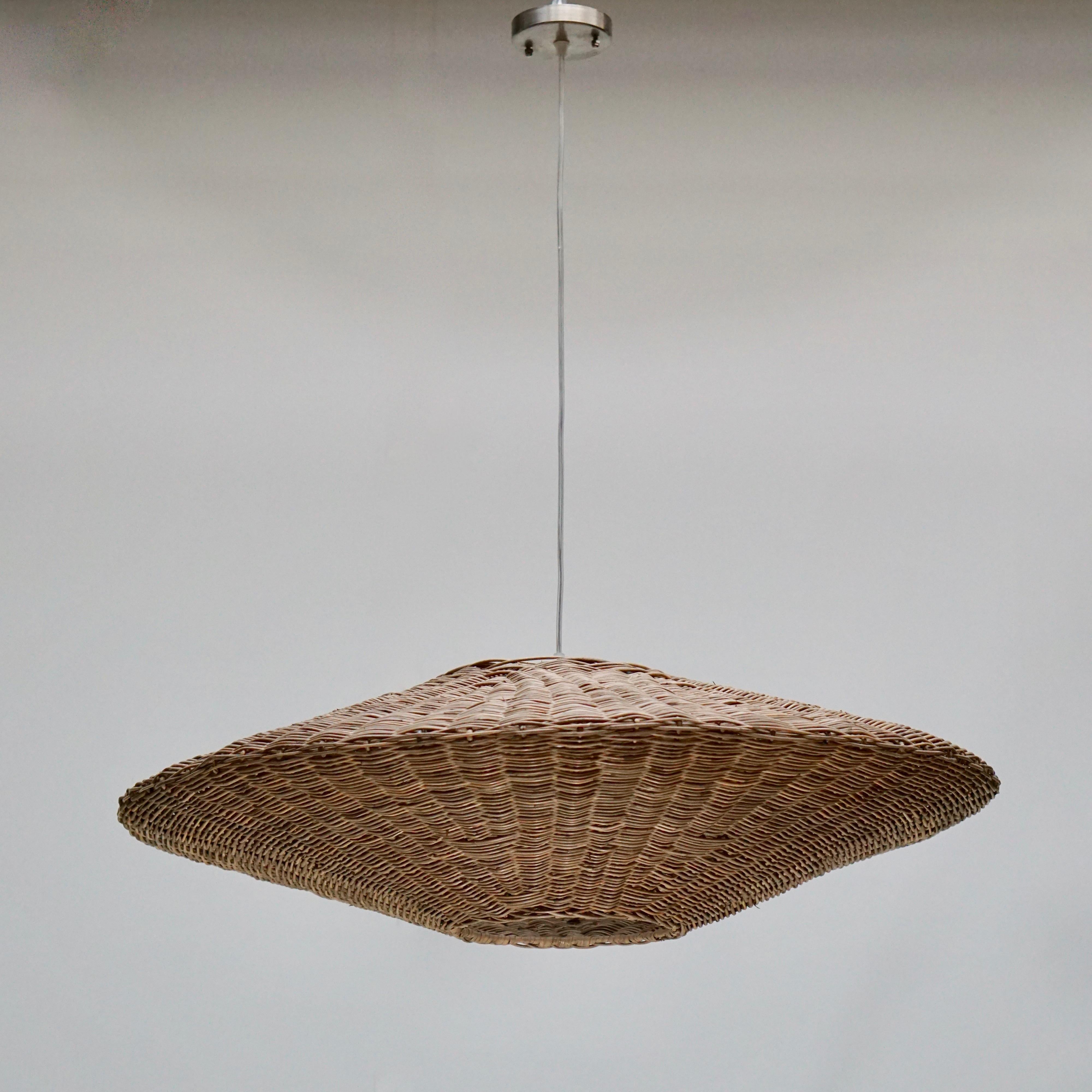 Large flogged cane rattan UFO ceiling light.
Measures: Diameter 82 cm.
Height fixture 24 cm.
Total height 135 cm.