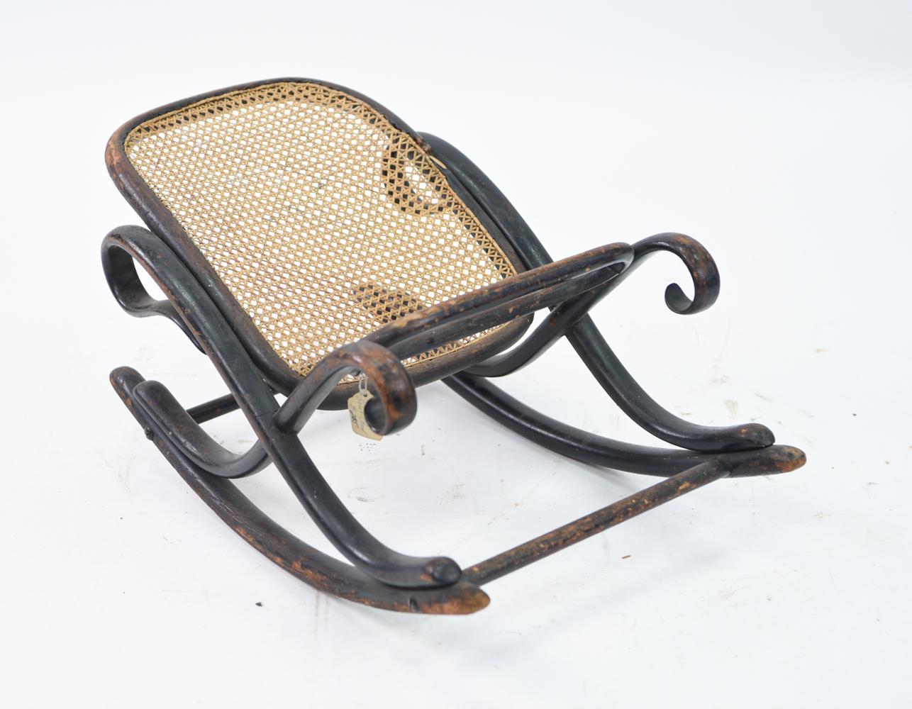 19th century cabinet maker Michael Thonet is credited with the invention of bentwood furniture. His iconic rocking chairs defined an era of style and continue to be sold and reproduced today. This footstool is attributed to Thonet's furniture