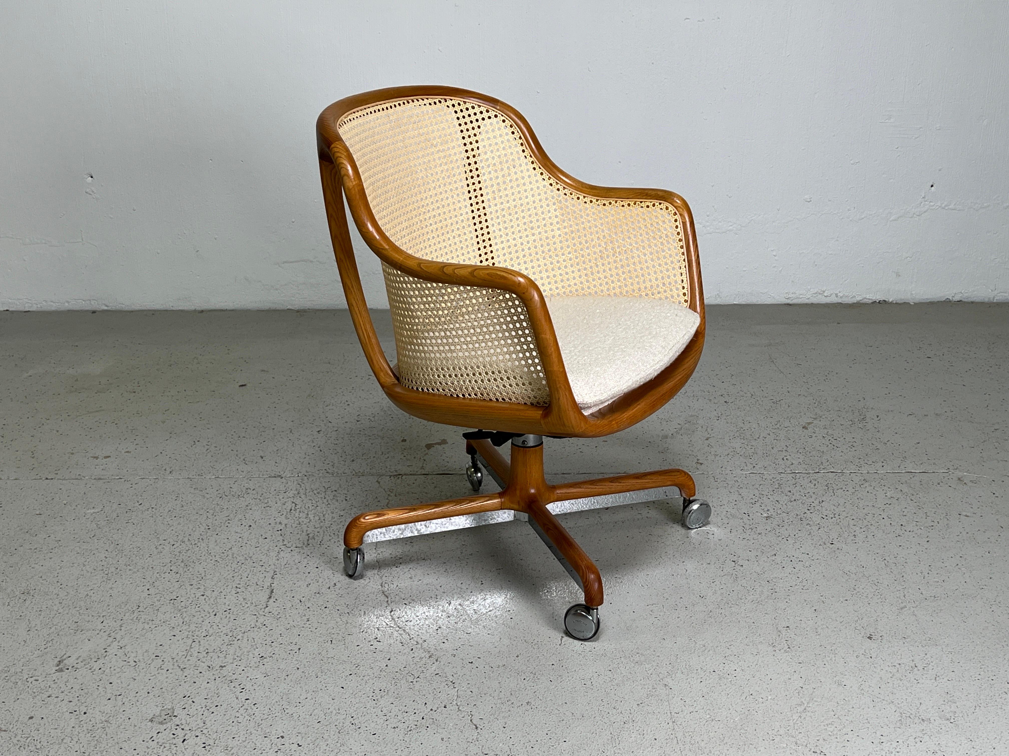 A fully caned tilt / swivel desk chair designed by Ward Bennett for Brickel.