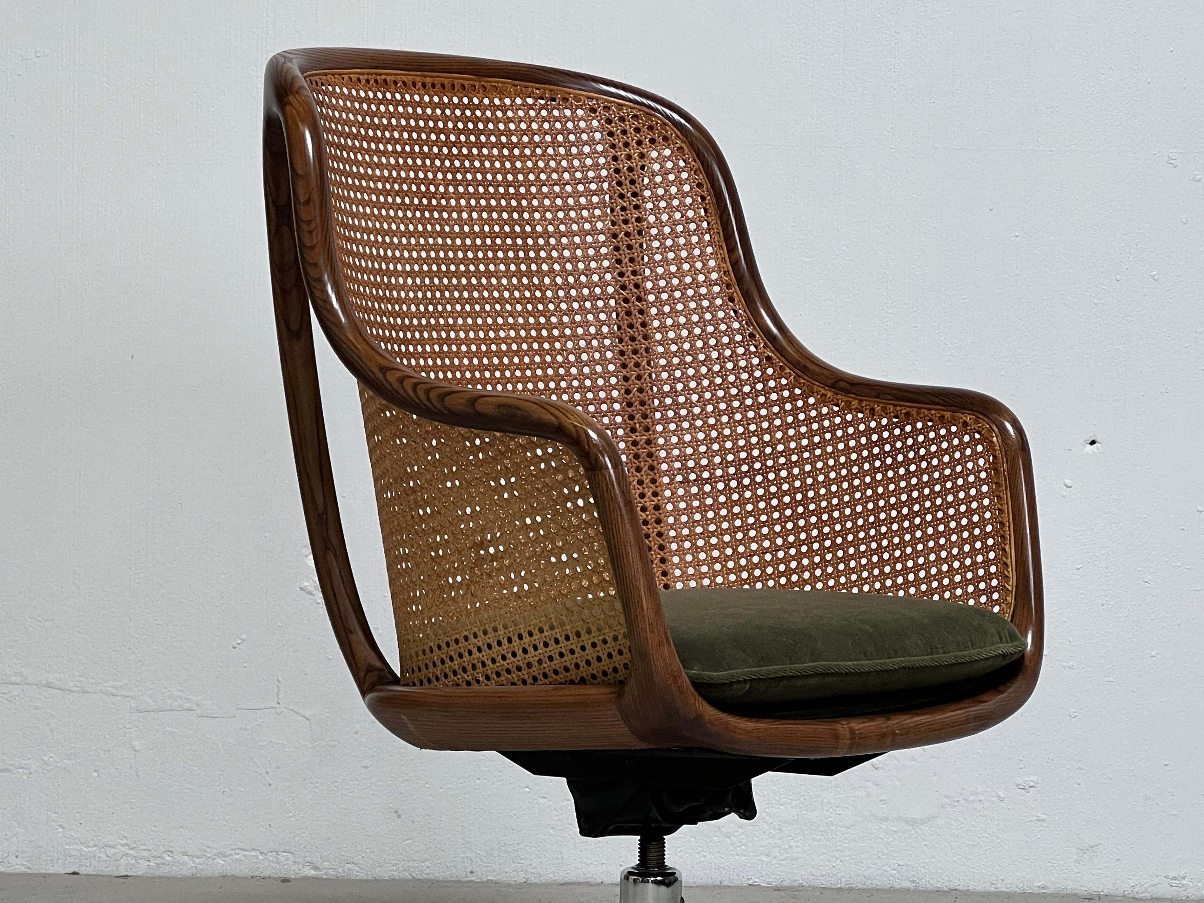 A caned back tilt / swivel desk chair with Ash frame designed by Ward Bennett for Brickel. Original finish and cane with nice patina. New upholstery. 