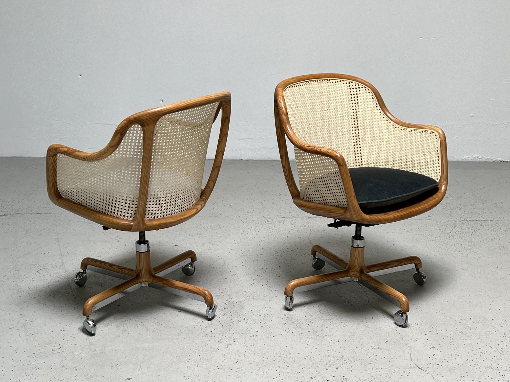 A fully caned tilt / swivel desk chair designed by Ward Bennett for Brickel. Several available. Priced individually.